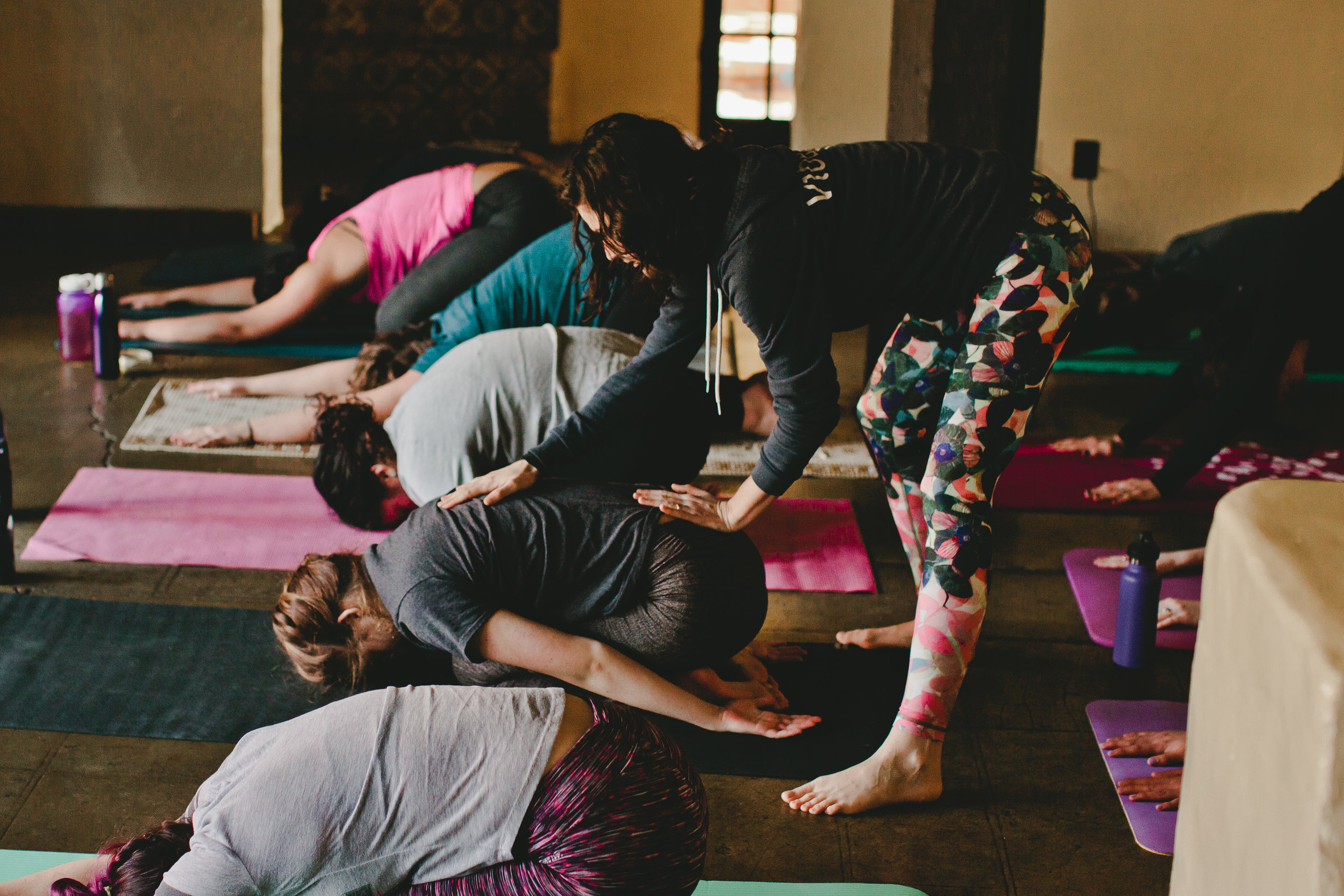 Misha Krepon representing Vibe Yoga Studio teaches vinyasa flow to kick-off the morning.