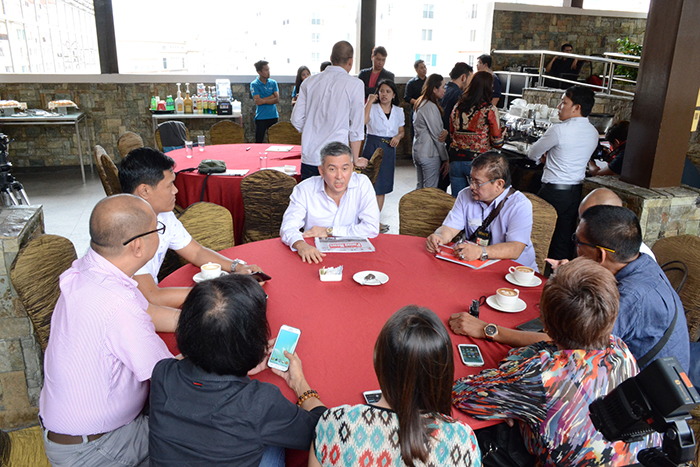 Mr. Leo de Leon (center) discusses the forthcoming event with the press corps.