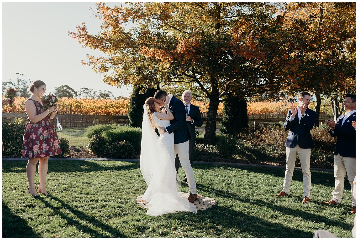 Bowral Southern Highlands Autumn Wedding - Centennial Vineyards first kiss on lawn