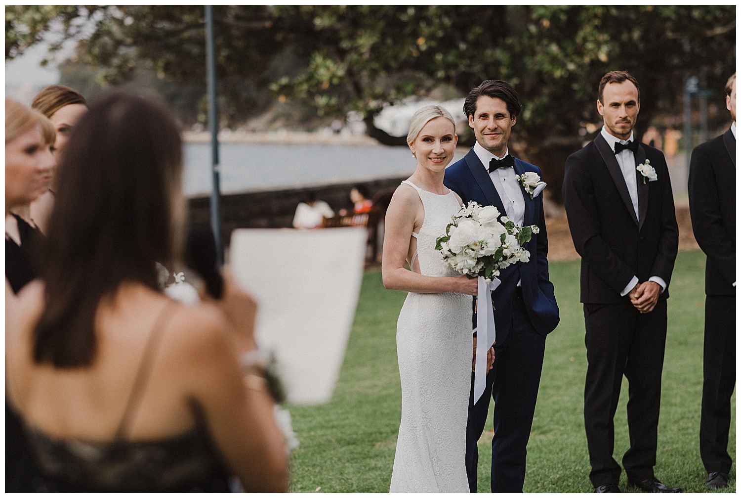 Bride and Groom listen to speeches at their Royal Botanic Gardens Wedding Ceremony