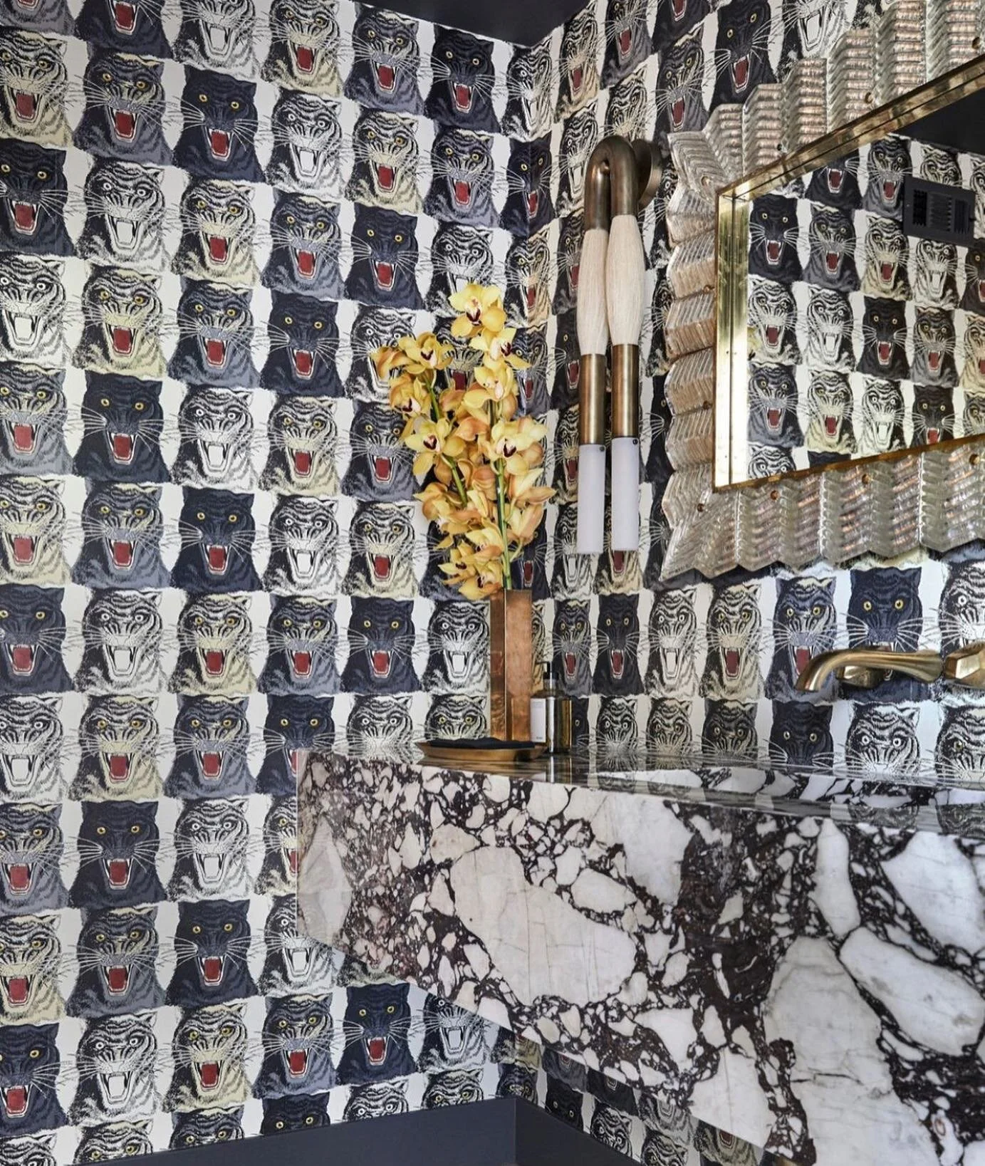 Incredible! What a statement bathroom 🐆 taken from the L.A. home of Miss Miley Cyrus photo thanks to @archdigest #bathroom #statement #insane #wallpaper #marble #brass