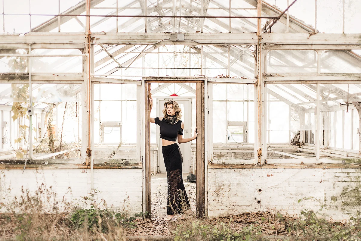 Model-in-black-lace-skirt-and-crop-top-in-abandoned-greenhouse-by-Atlanta-photographer-Chanel-French.jpg