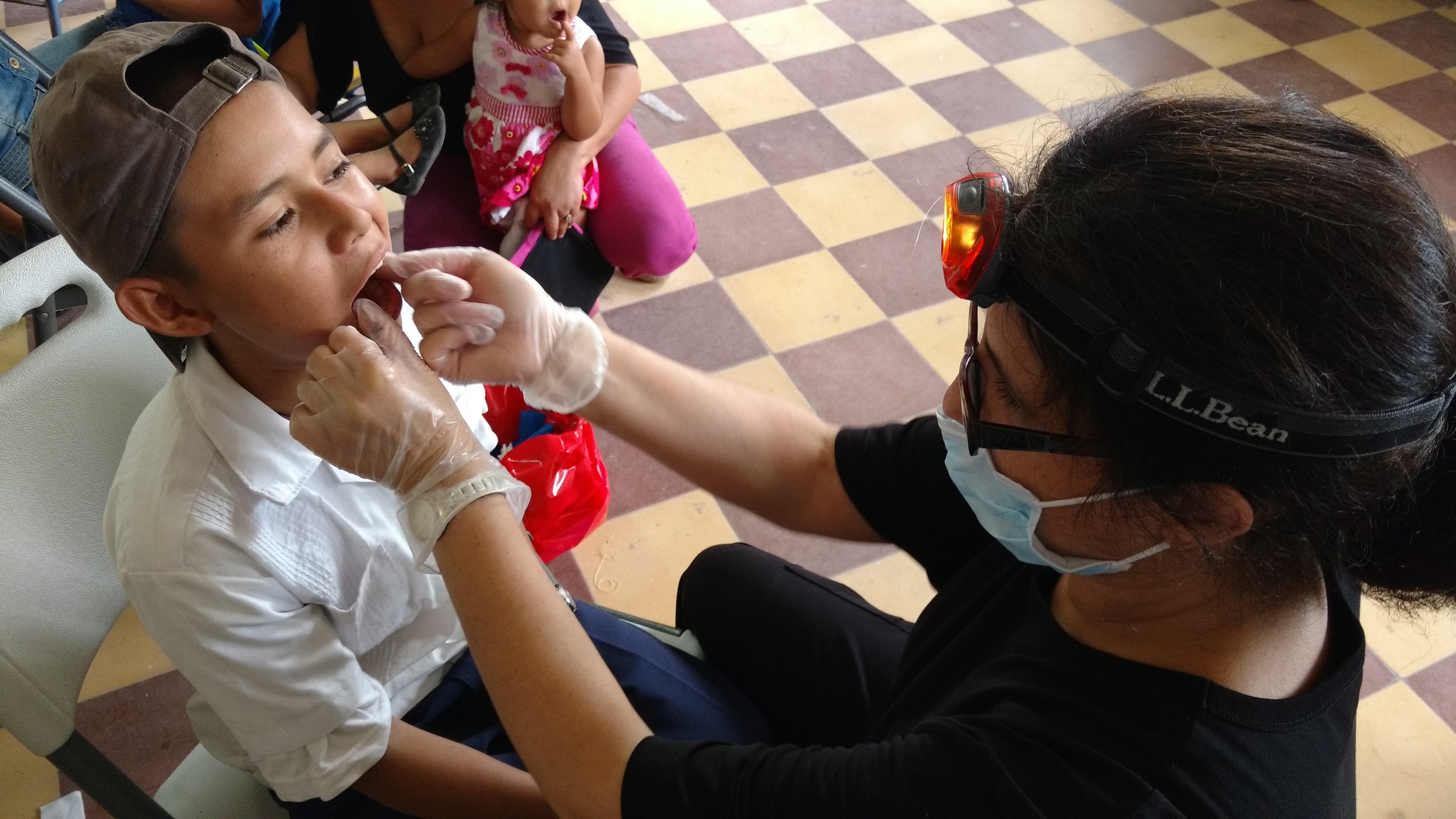Dr. Tinka Kornerup applying fluroride to this young man's teeth. 