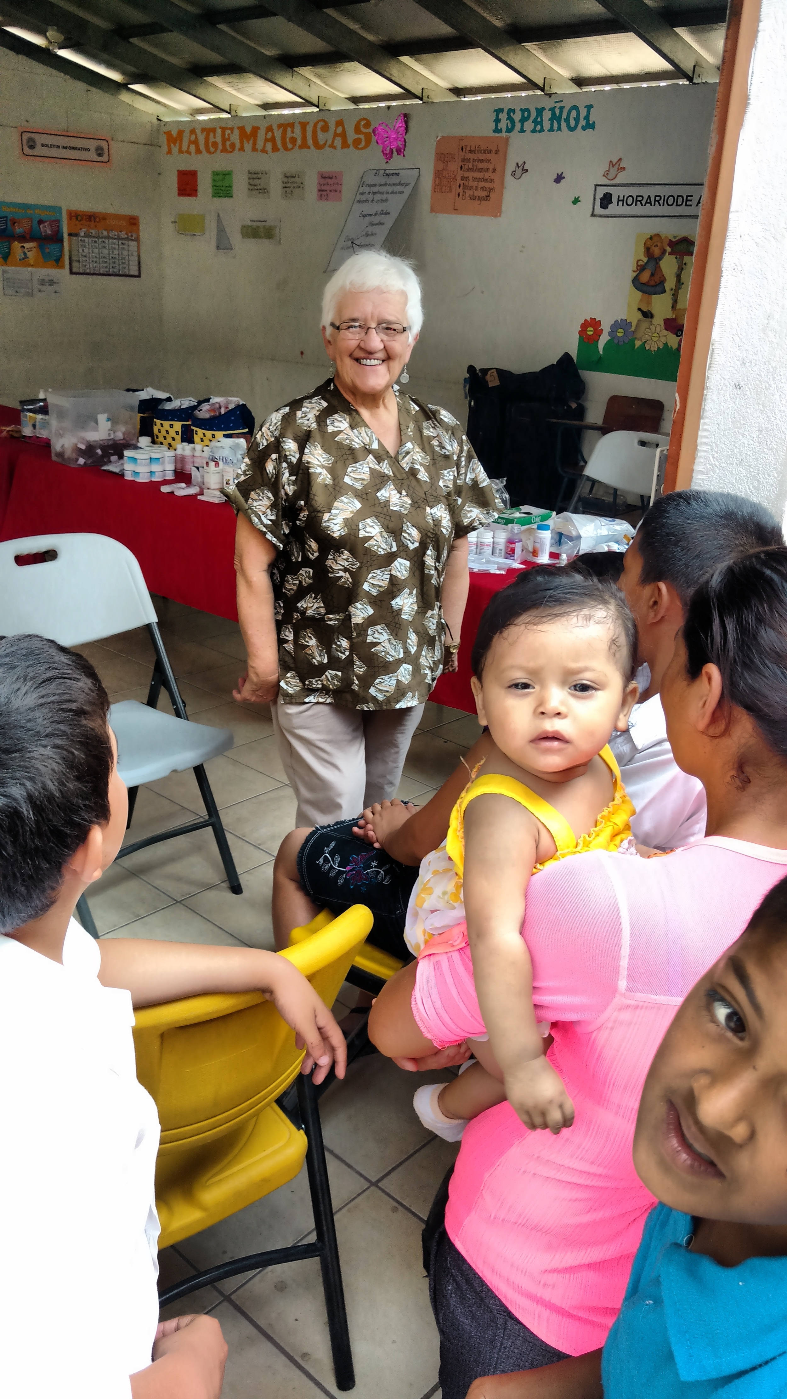 Esther Kern is a veteran of our group, and this is her 16th year coming to Honduras! Here, she is pictured in the pharmacy, where she provides medication and instructions to patients and their families.