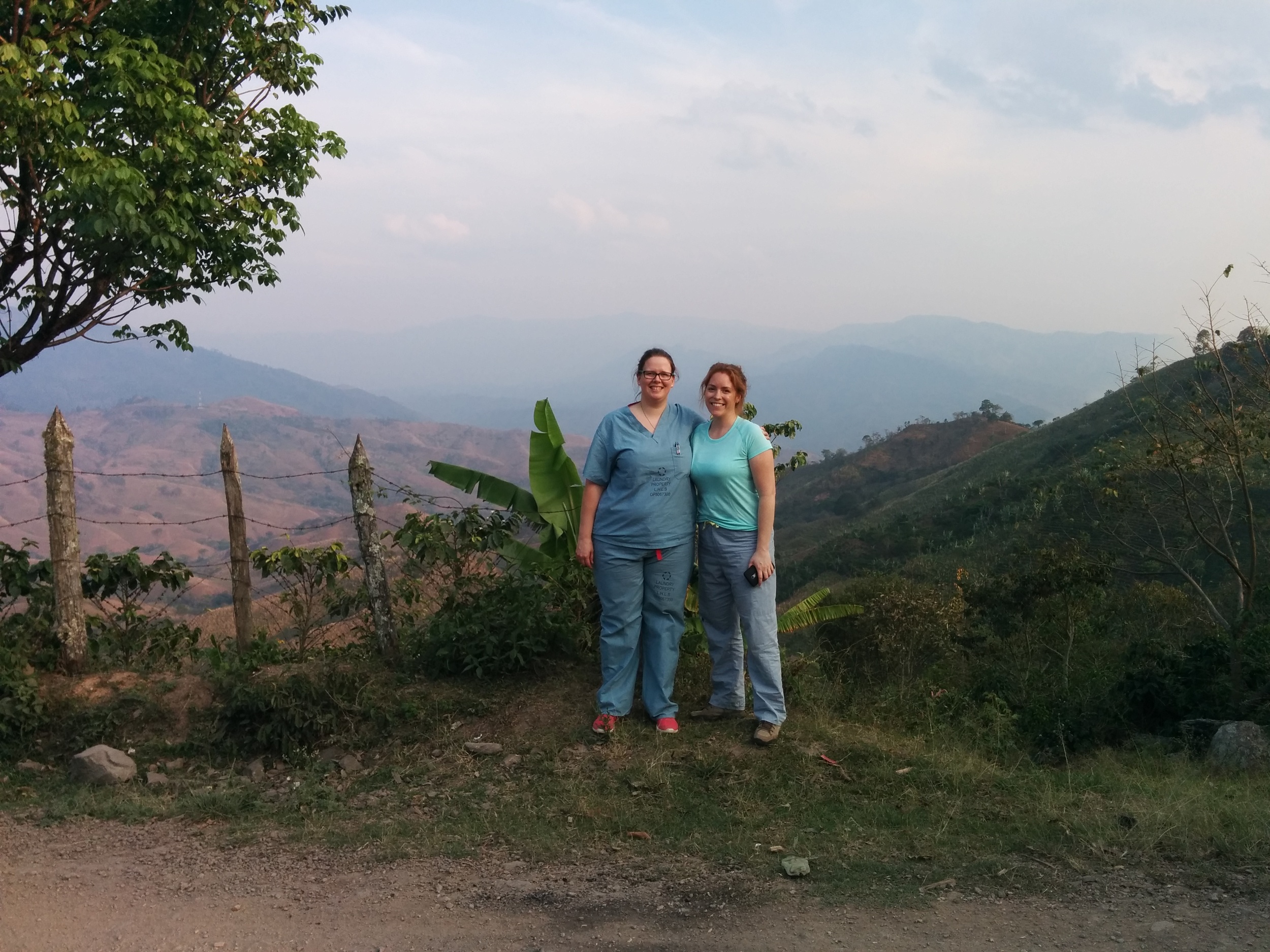 Heather and Chloe, Pediatric Residents, stopping for a picture with the breathtaking Honduran scenery after a day's work. 