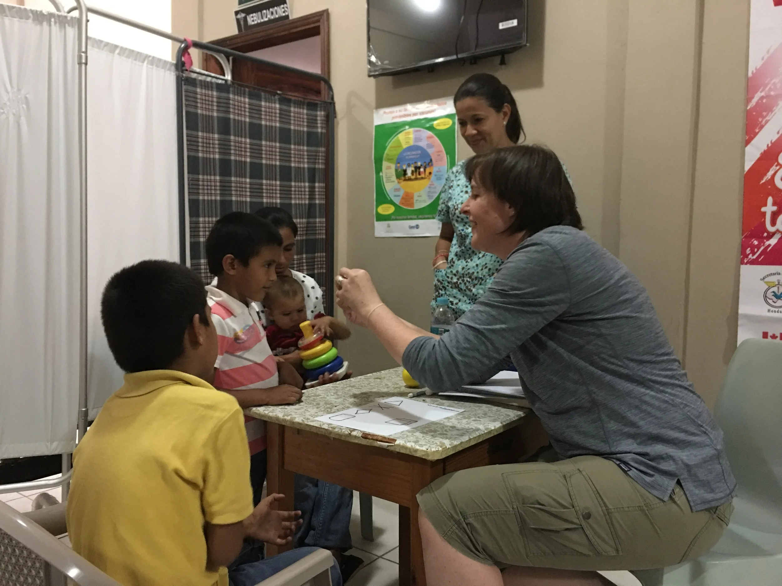 Laura working with a child during a learning disability assessment.