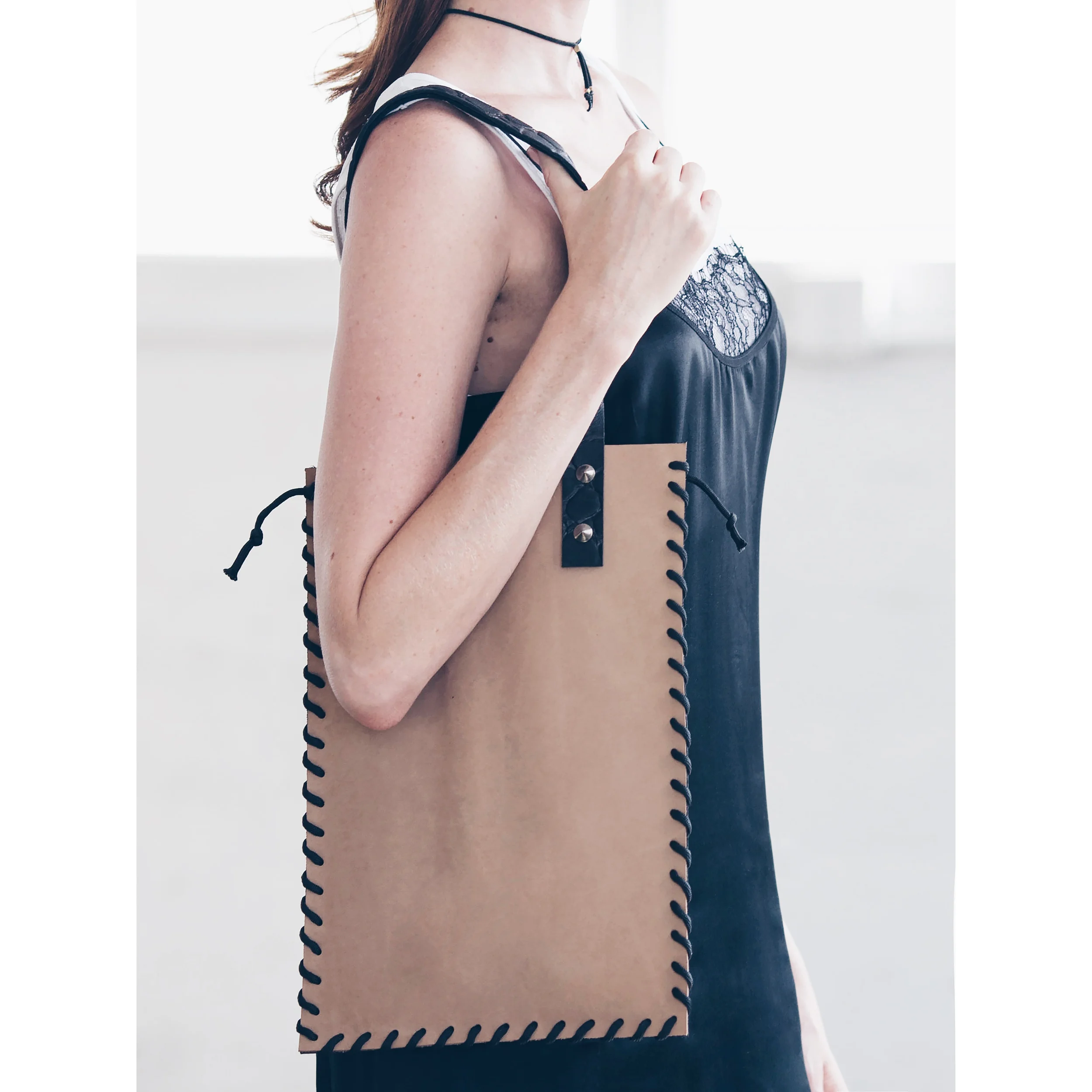 Paper Machine 2 tone leather shopper hand laced seams and embossed lambs leather straps