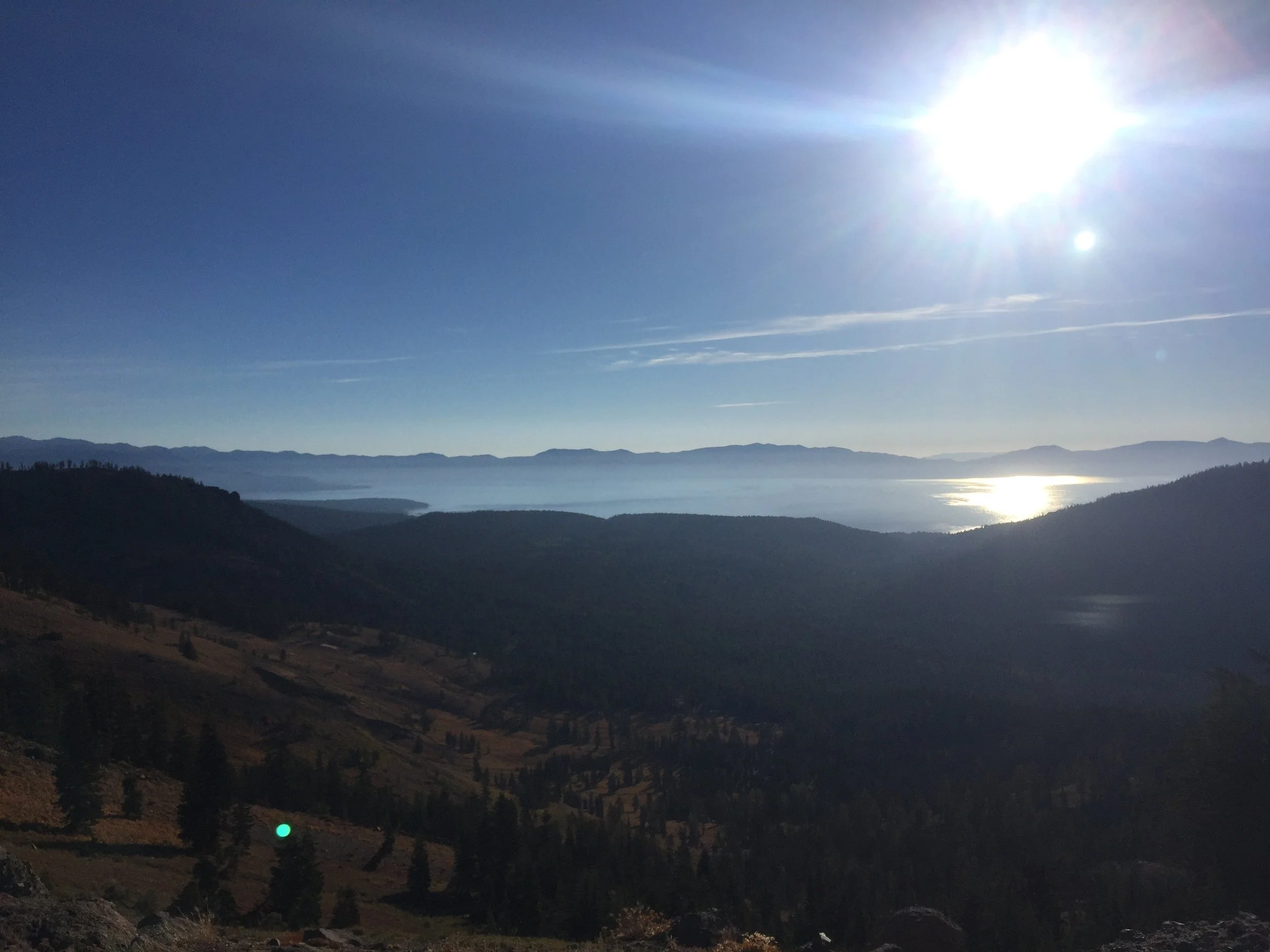 Lake Tahoe glitters in the morning sunlight from our high ridgeline vantage point