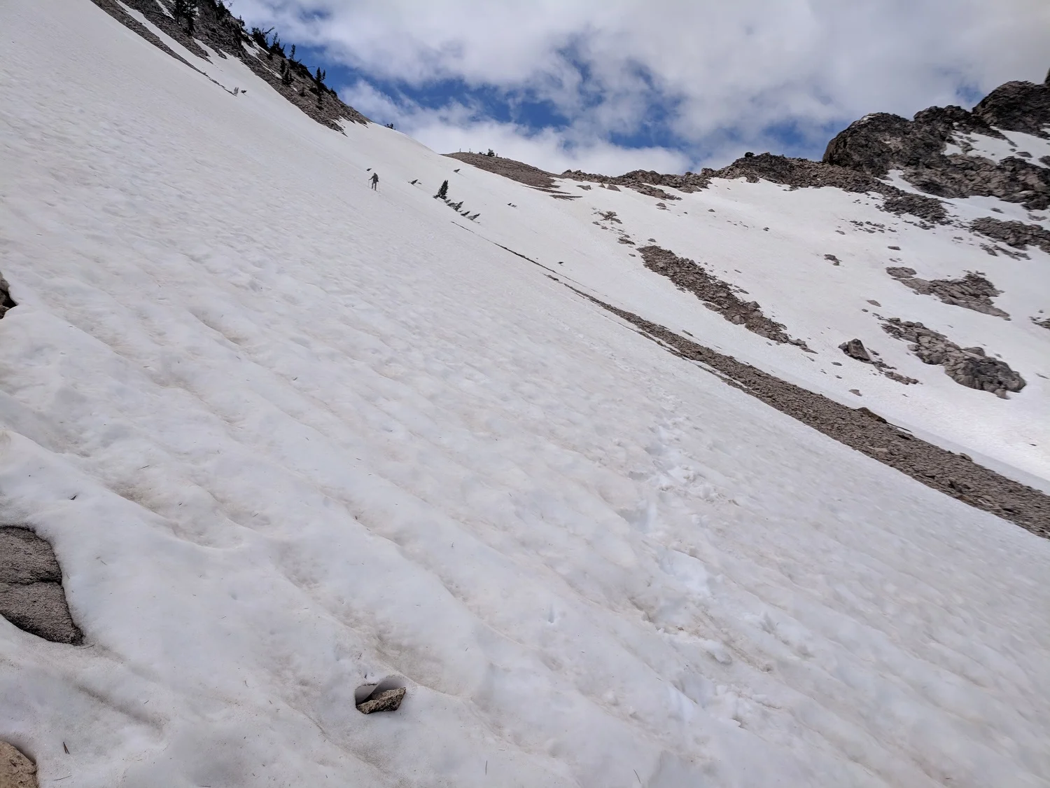 Andrew making his way down a steeper, longer snowfield
