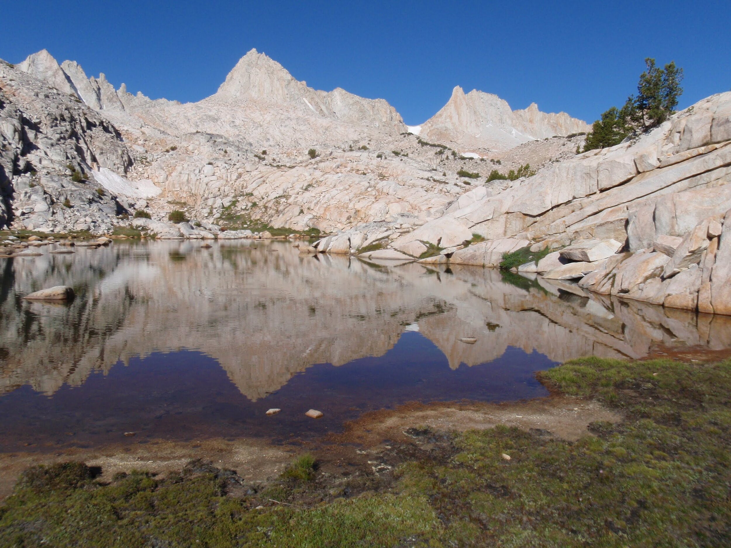 Day2 Perfect peaks reflected in puddle Granite Park.JPG