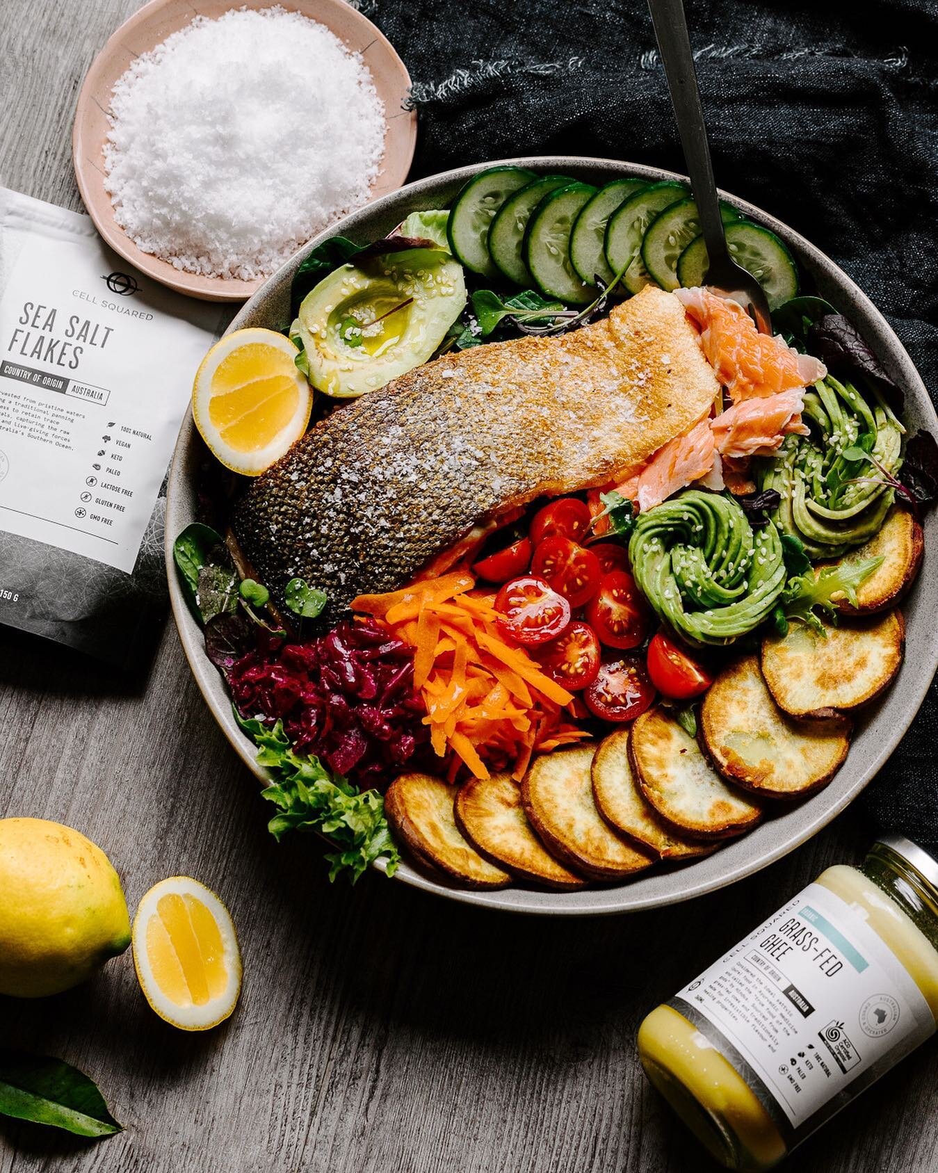 This bowl may look soFISHticated 😂 but it&rsquo;s a simple meal of wild-caught, melt in your mouth salmon cooked in copious amounts of @cellsquared organic ghee to make the skin EXTRA crispy, roasted purple sweet potato, creamy avocado and salad veg