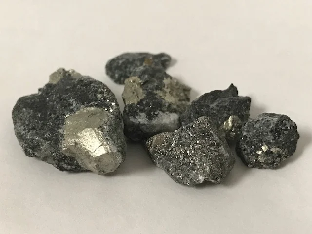 Pyrite rich grab samples from fine ore stream. The visible metallic substance is pyrite not gold, but microscopic gold is associated with this type of detrital pyrite.