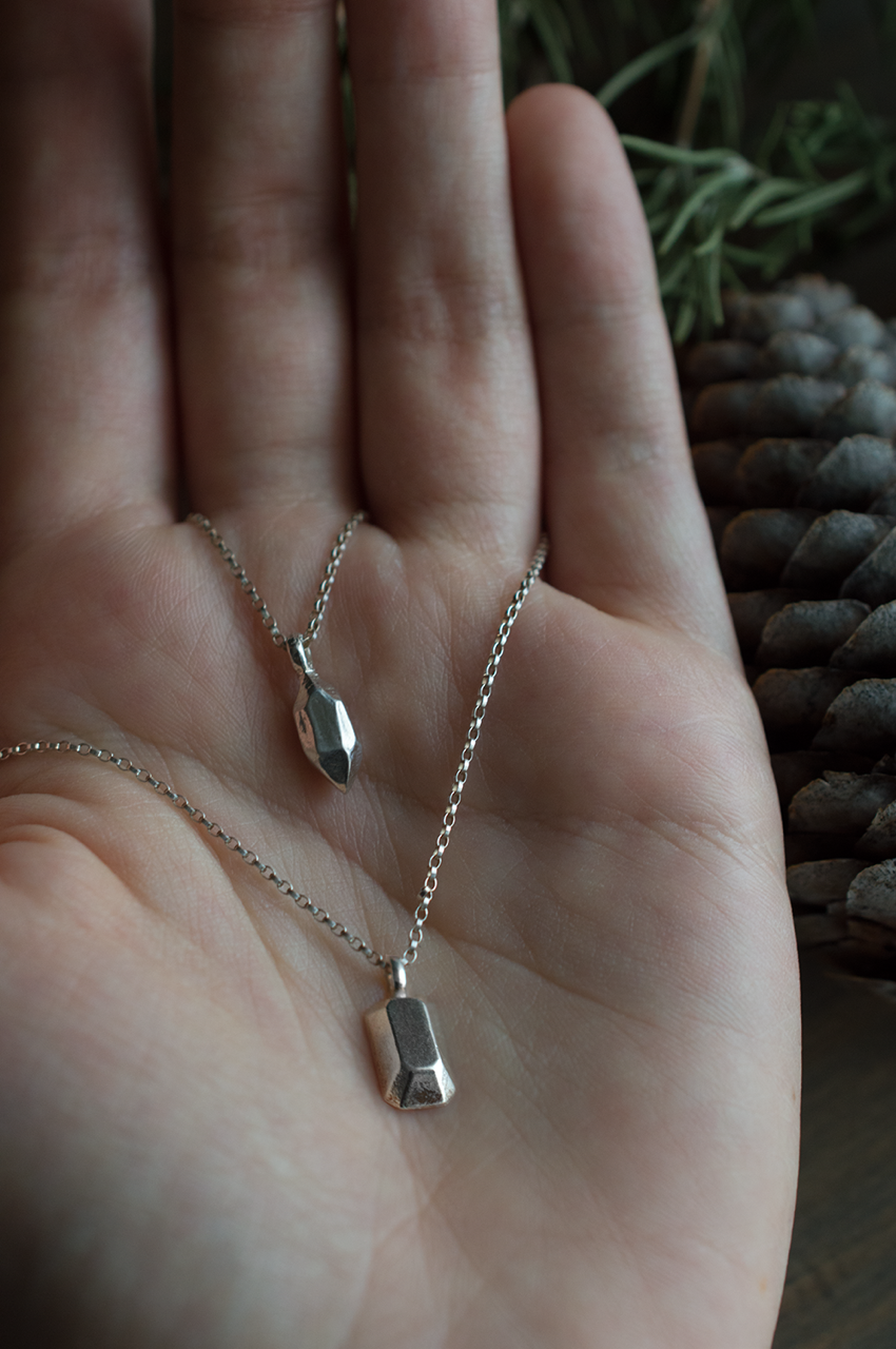 Emerald Cut and Earthy Point Necklace in Hand - small.png