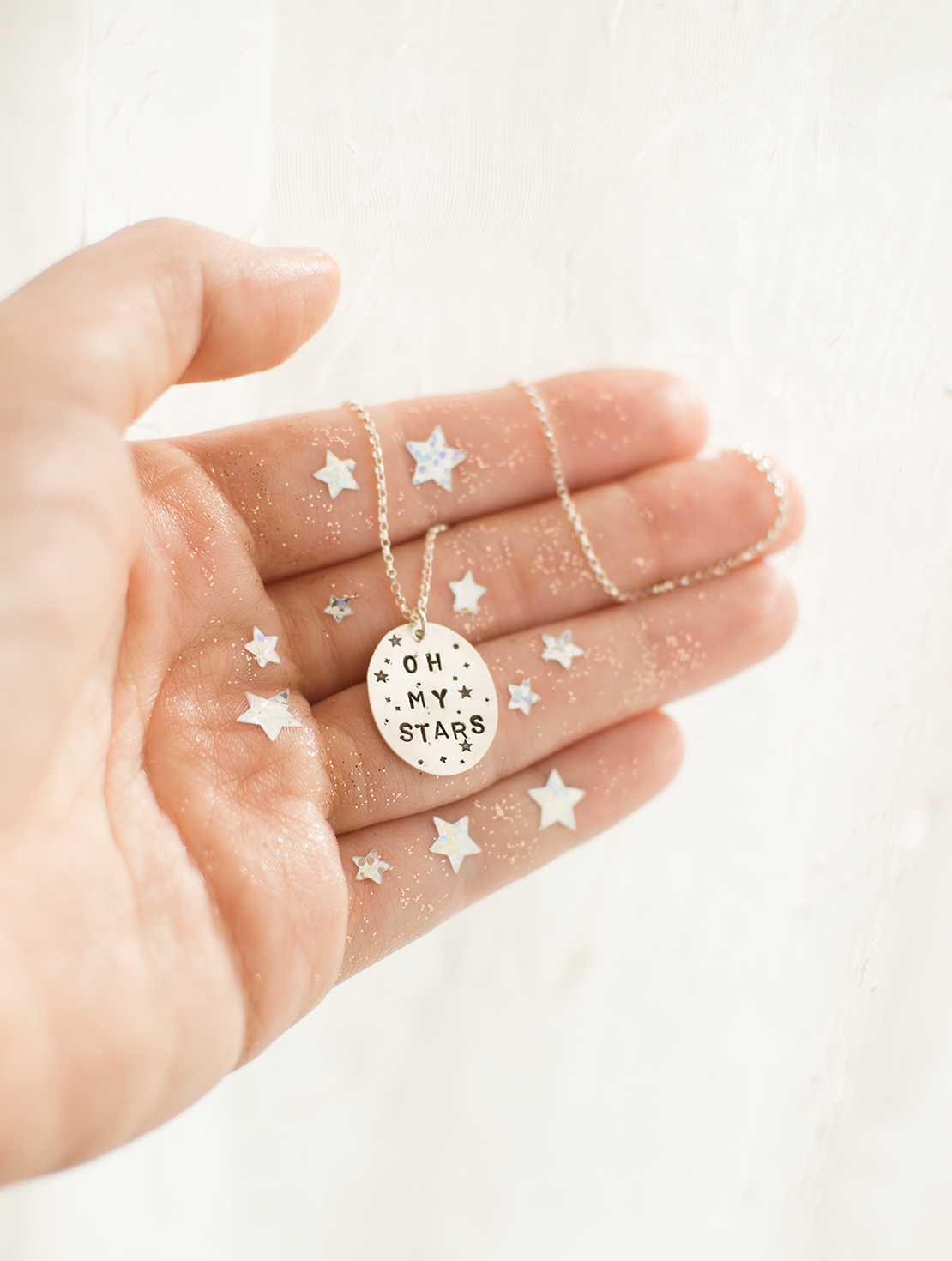 Oh My Stars ! Necklace by Good Looking Objects, magical whimsical jewery, sparkle stars hand 1.png