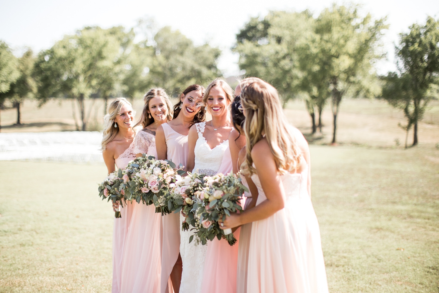 bride with bridesmaids outside at Rick's Place in Tulsa, Oklahoma