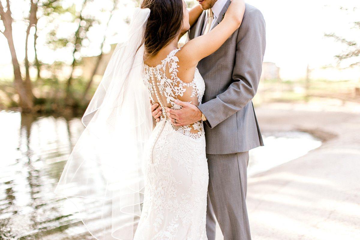Here, Taylor was shooting wide and perpendicular to the couple, so I stood to the side and got a tight shot focusing on the back of her dress and the way his hands were gently touching her.