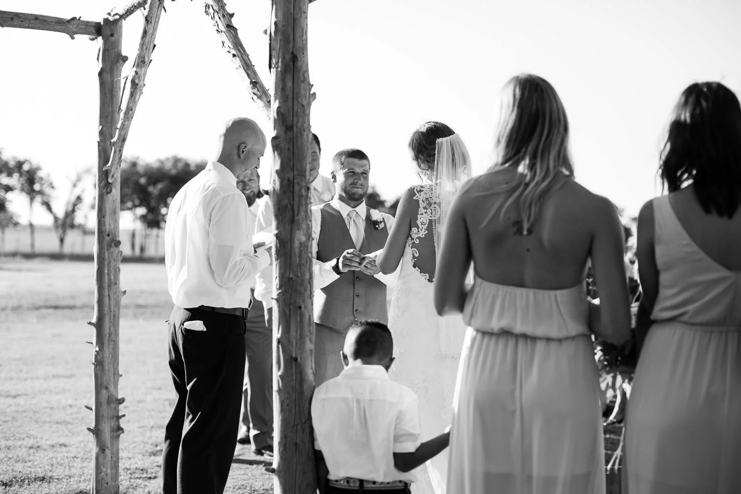 While Jordan stood in the center aisle, I ducked behind the bridesmaids to focus on the groom's face as he said his vows.