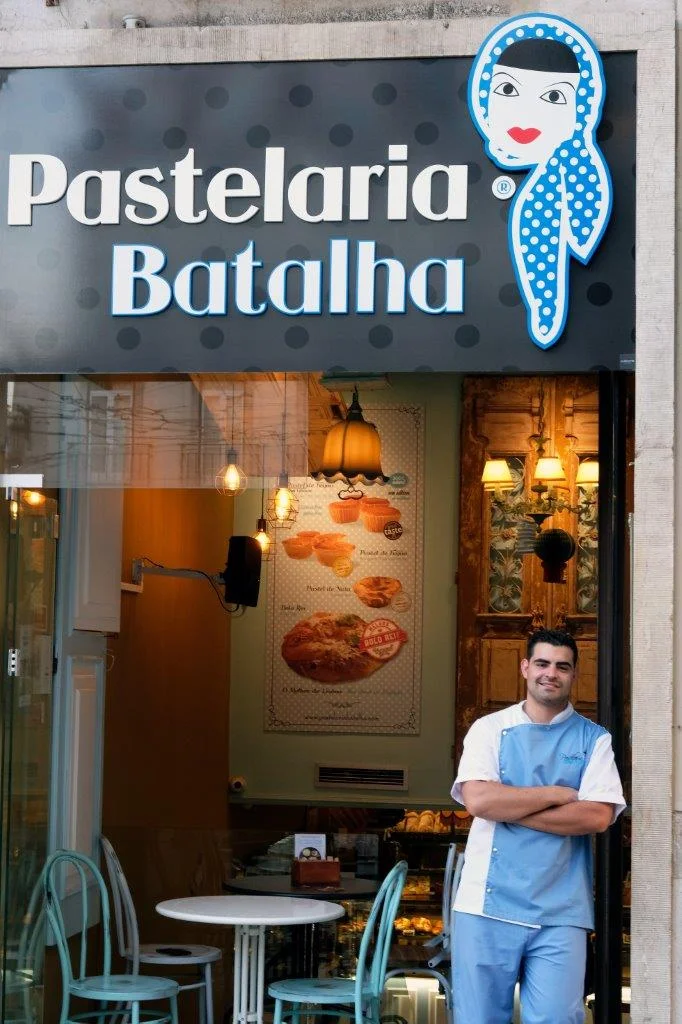Award-winning pastry chef João Batalha standing in front of Pastelaria Batalha in Lisbon, Portugal. Photographer: Paulo Petronilho