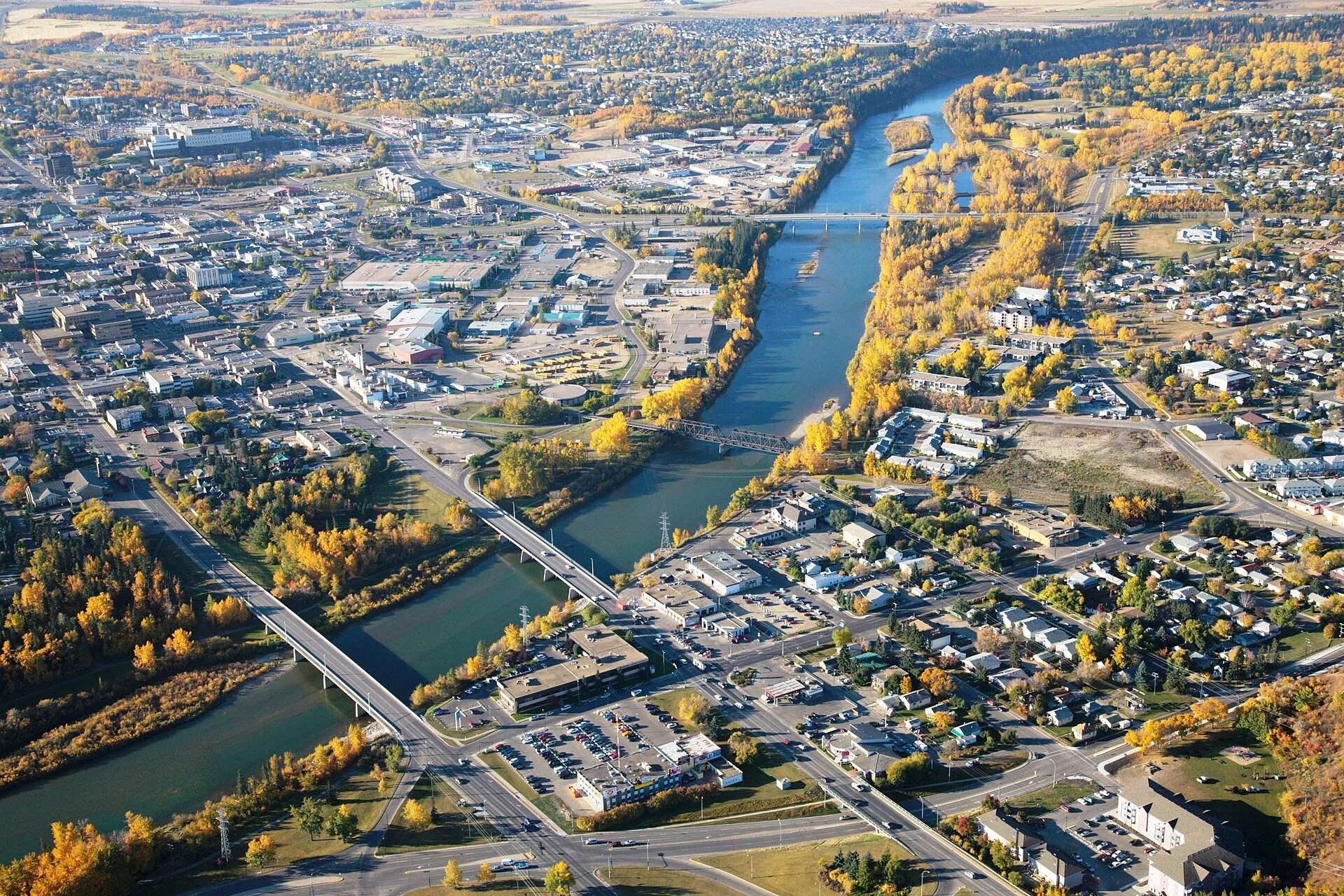 An aerial view of Red Deer with bridges over the river near downtown.