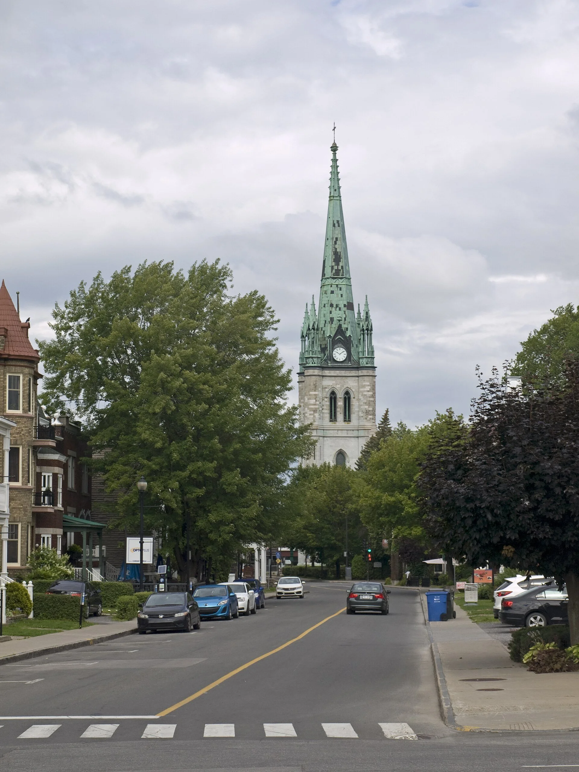 The green spire of the Cathédrale de l'Assomption rising above Rue Bonaventure in Trois-Rivières.