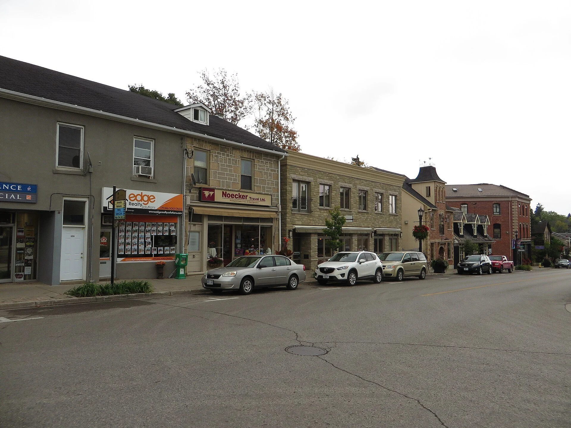 Historic shopfronts along a street in downtown Elora, Ontario.