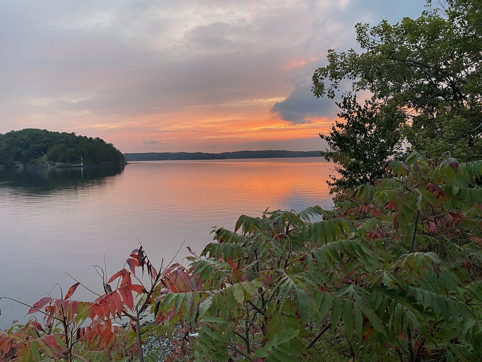Sunset over the water of Parry Sound seen from the waterfront fitness trail.