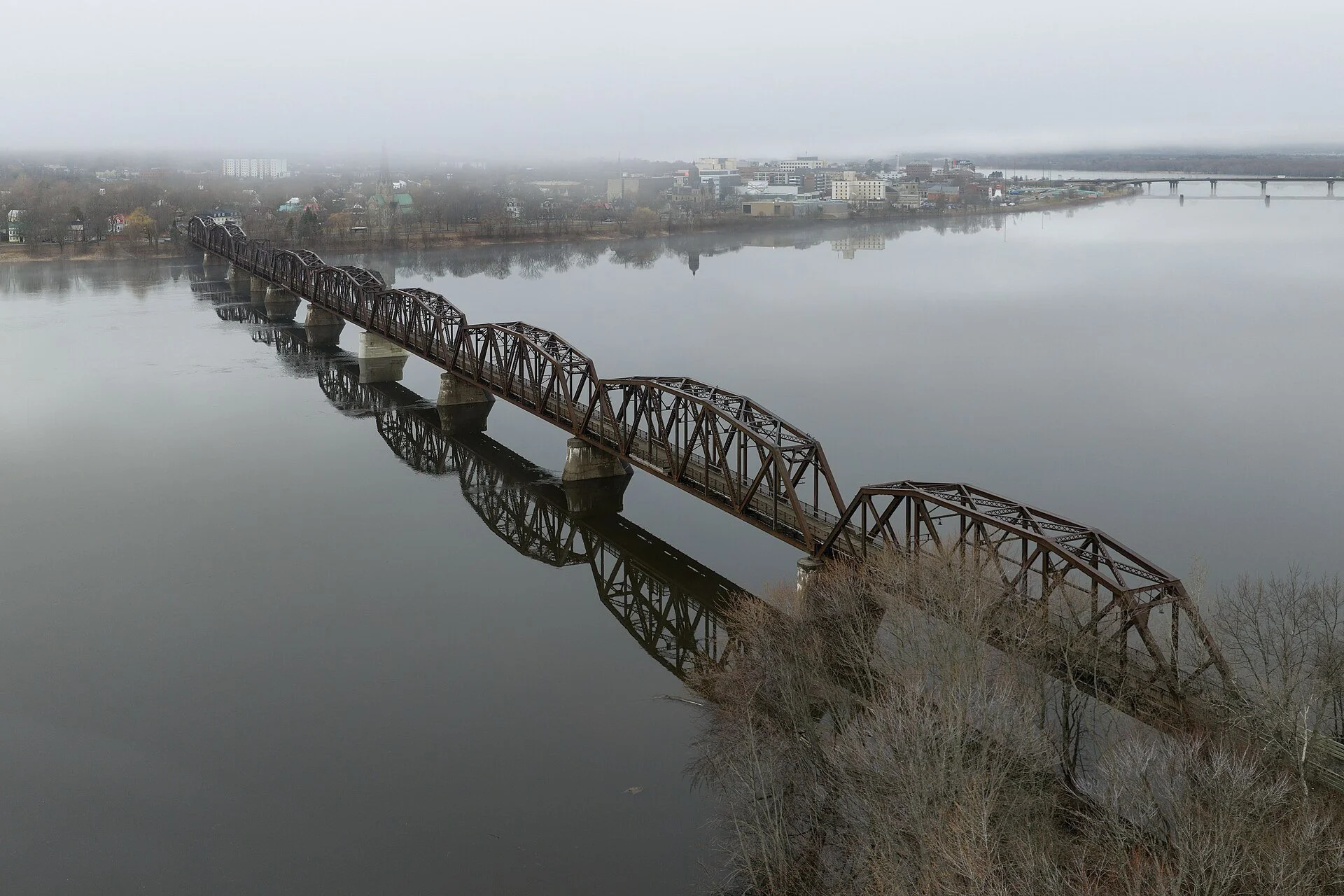 The Bill Thorpe Walking Bridge, a former railway bridge, crossing the Saint John River at Fredericton.