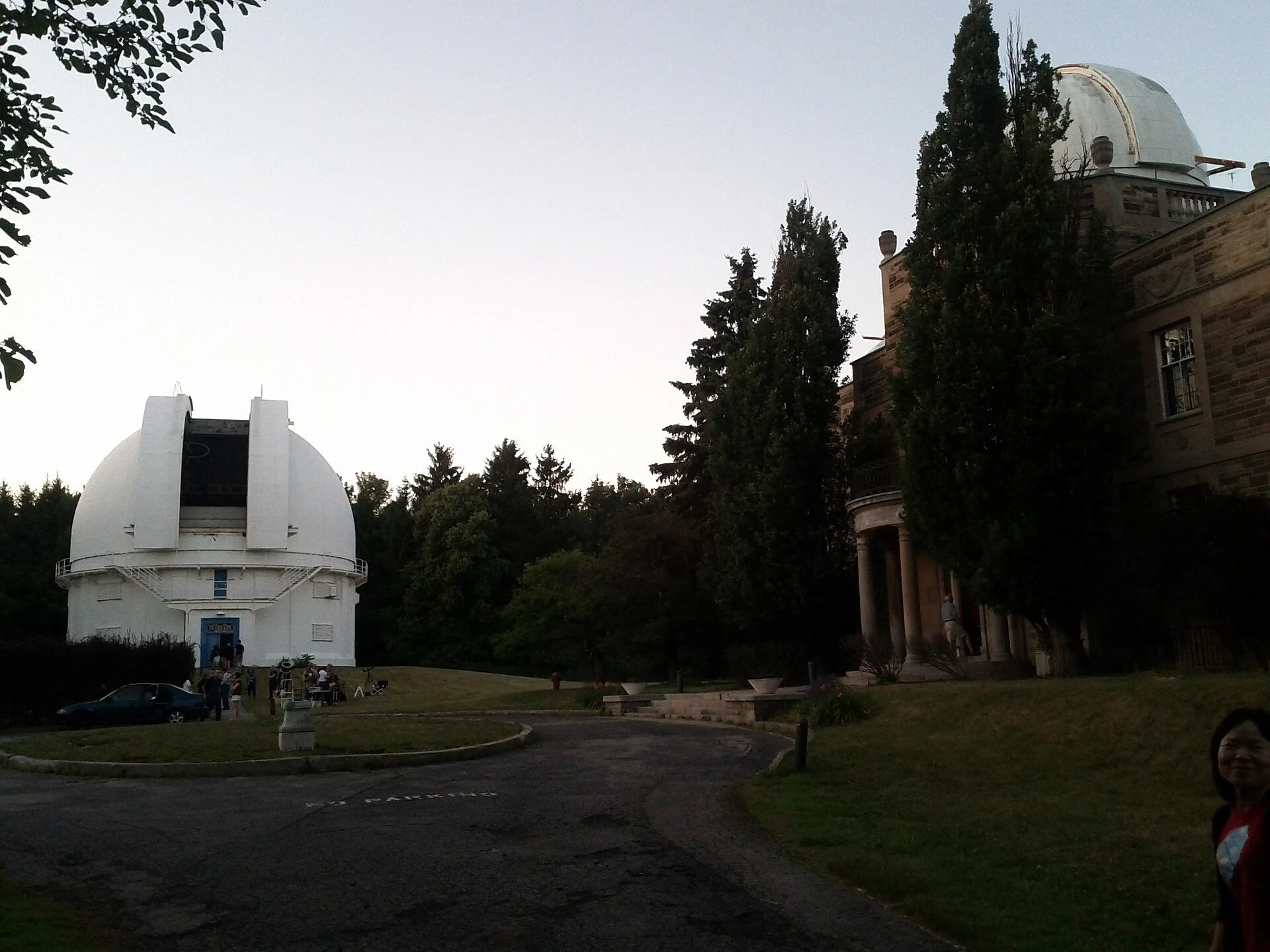 The white dome of the David Dunlap Observatory beside the Administration Building in Richmond Hill.