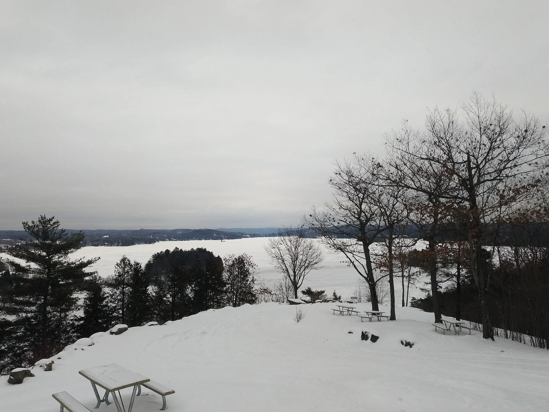 Snowy view from Lions Lookout over Fairy Lake in Huntsville in winter.