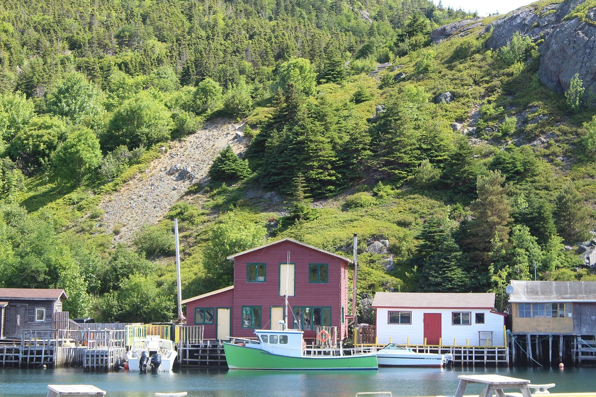 Small boats and buildings in the harbour at Quidi Vidi village.