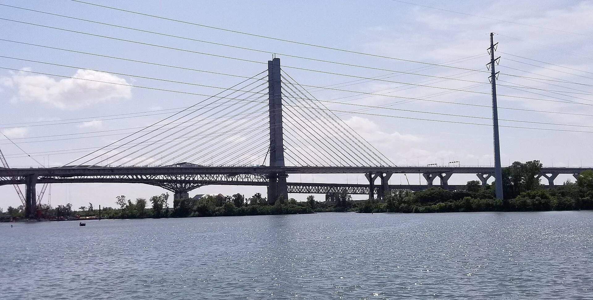The Samuel De Champlain Bridge stretching across the St. Lawrence River, seen from the Brossard shore.