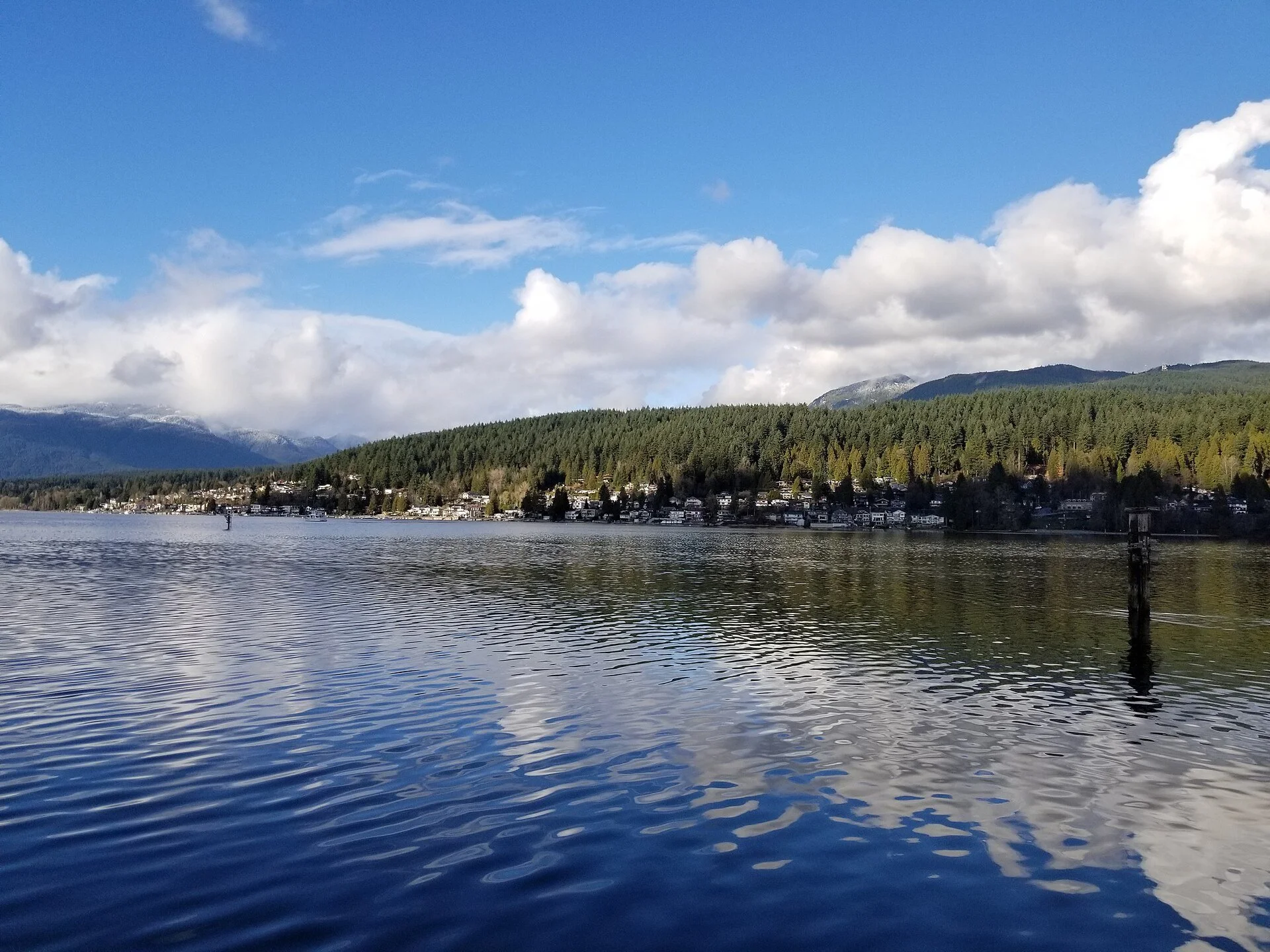Burrard Inlet and forested hills seen from Rocky Point in Port Moody on a winter day.
