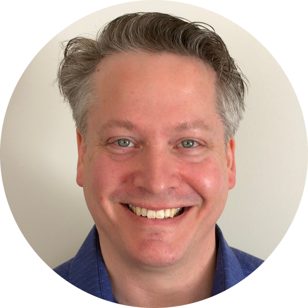 Dr. Paul Hommersen, clinical psychologist, smiling in a blue shirt