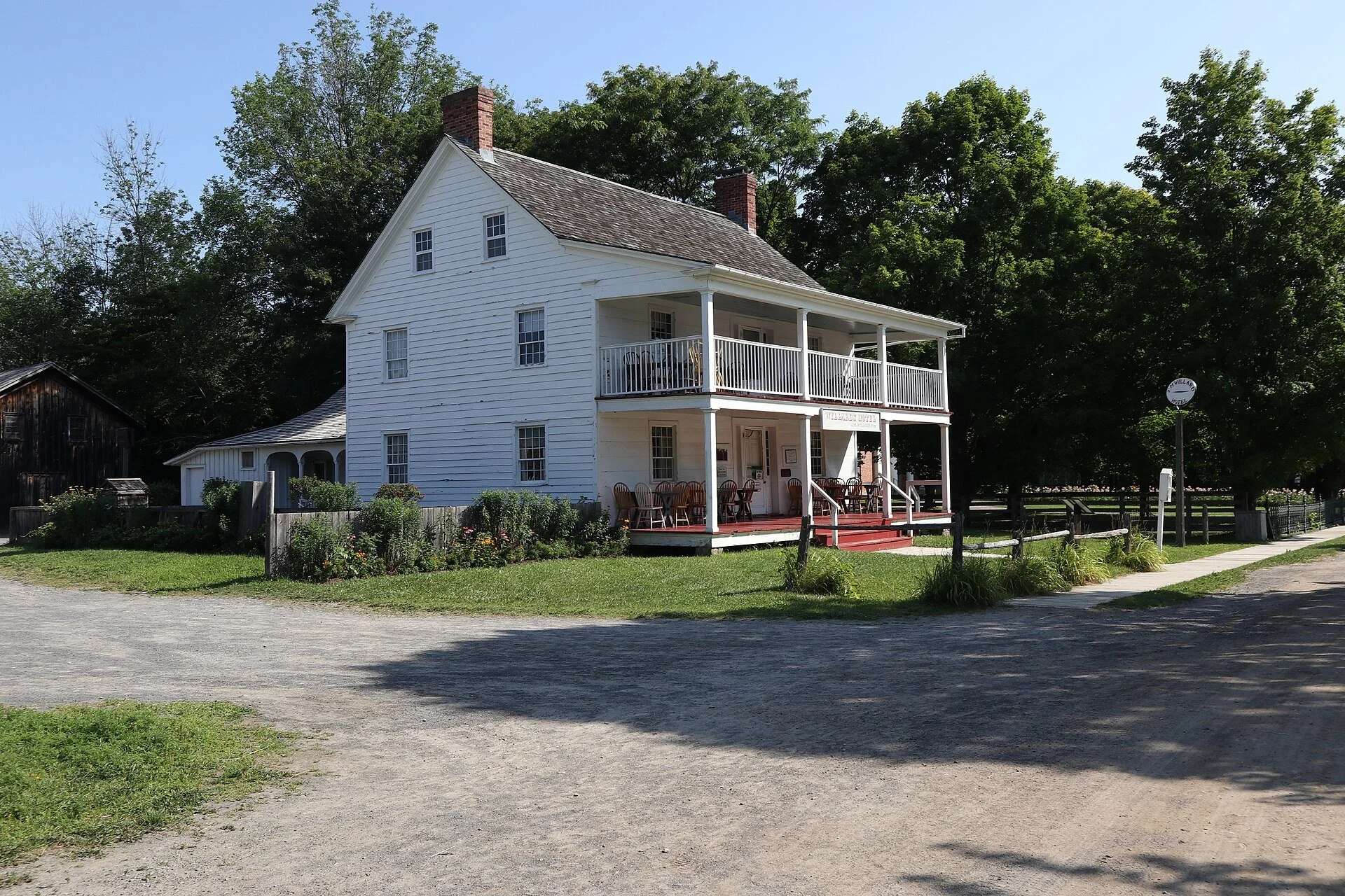 The white clapboard Willard's Hotel with its two-storey veranda at Upper Canada Village in Morrisburg.