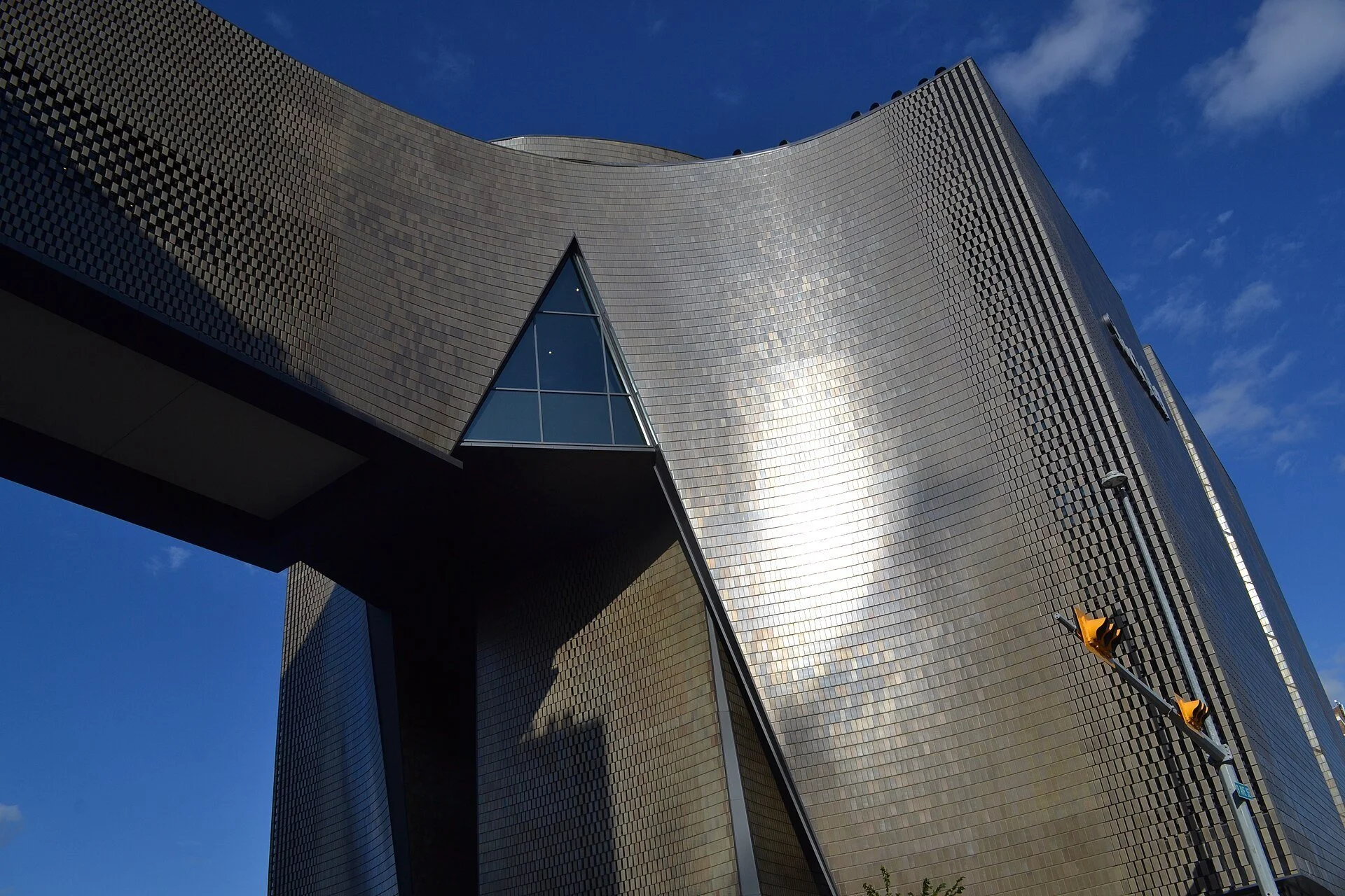 The curved, tiled exterior of Studio Bell, home of the National Music Centre, in Calgary's East Village.