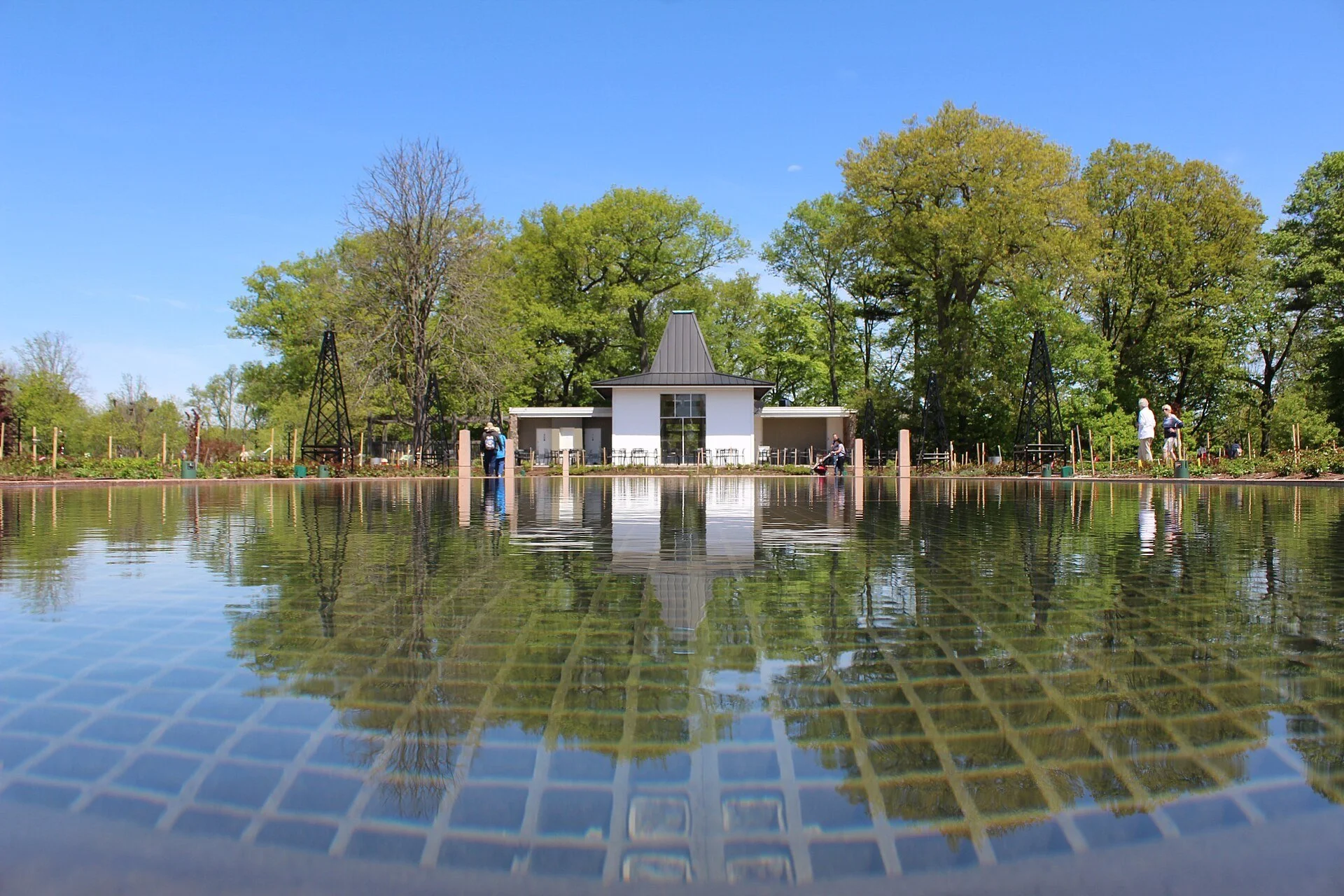 Reflecting pools and a small pavilion among spring trees in Hendrie Park at the Royal Botanical Gardens in Burlington.