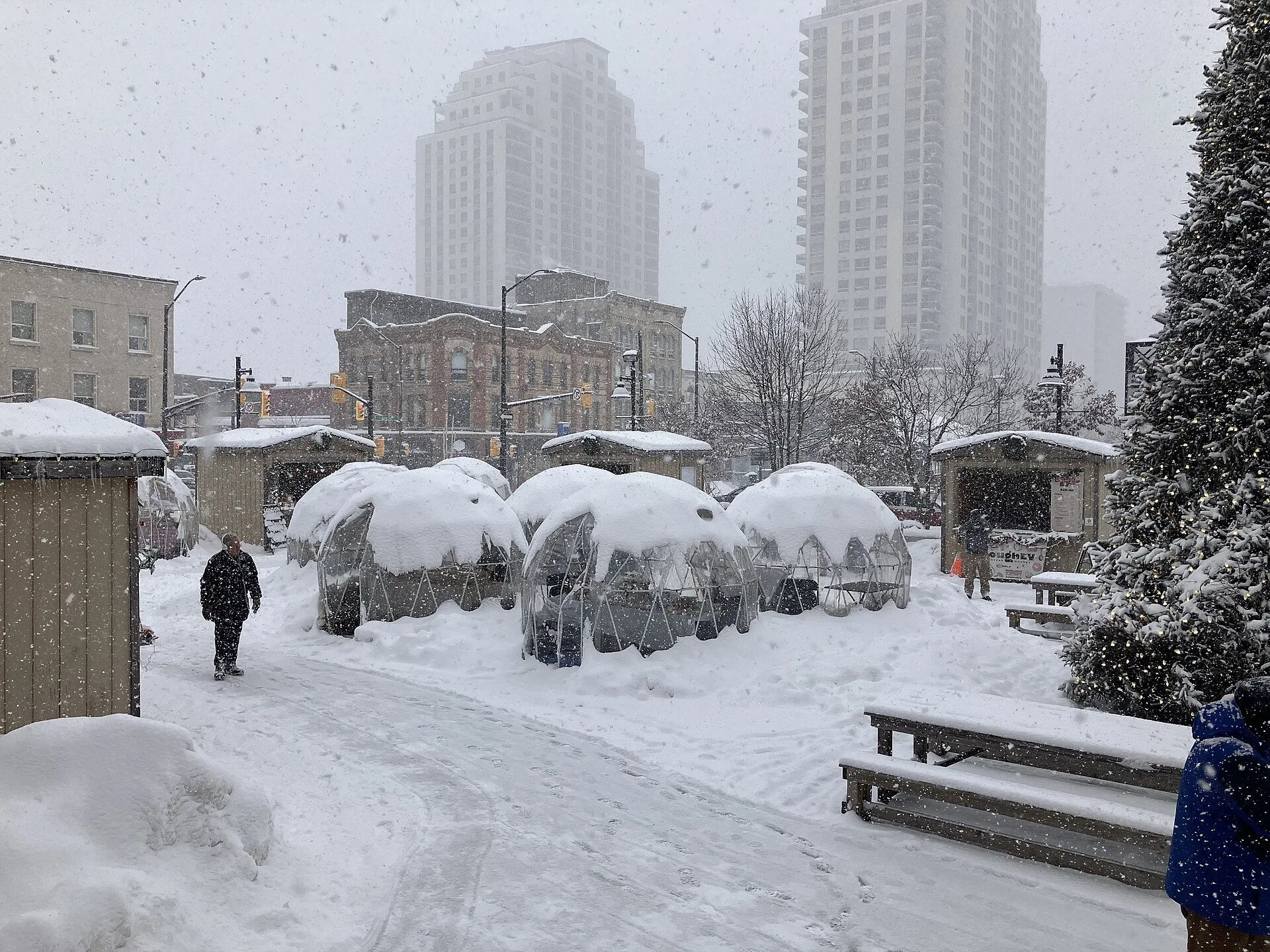 Snow covered market stalls and dining domes on the square at Covent Garden Market in London, Ontario.