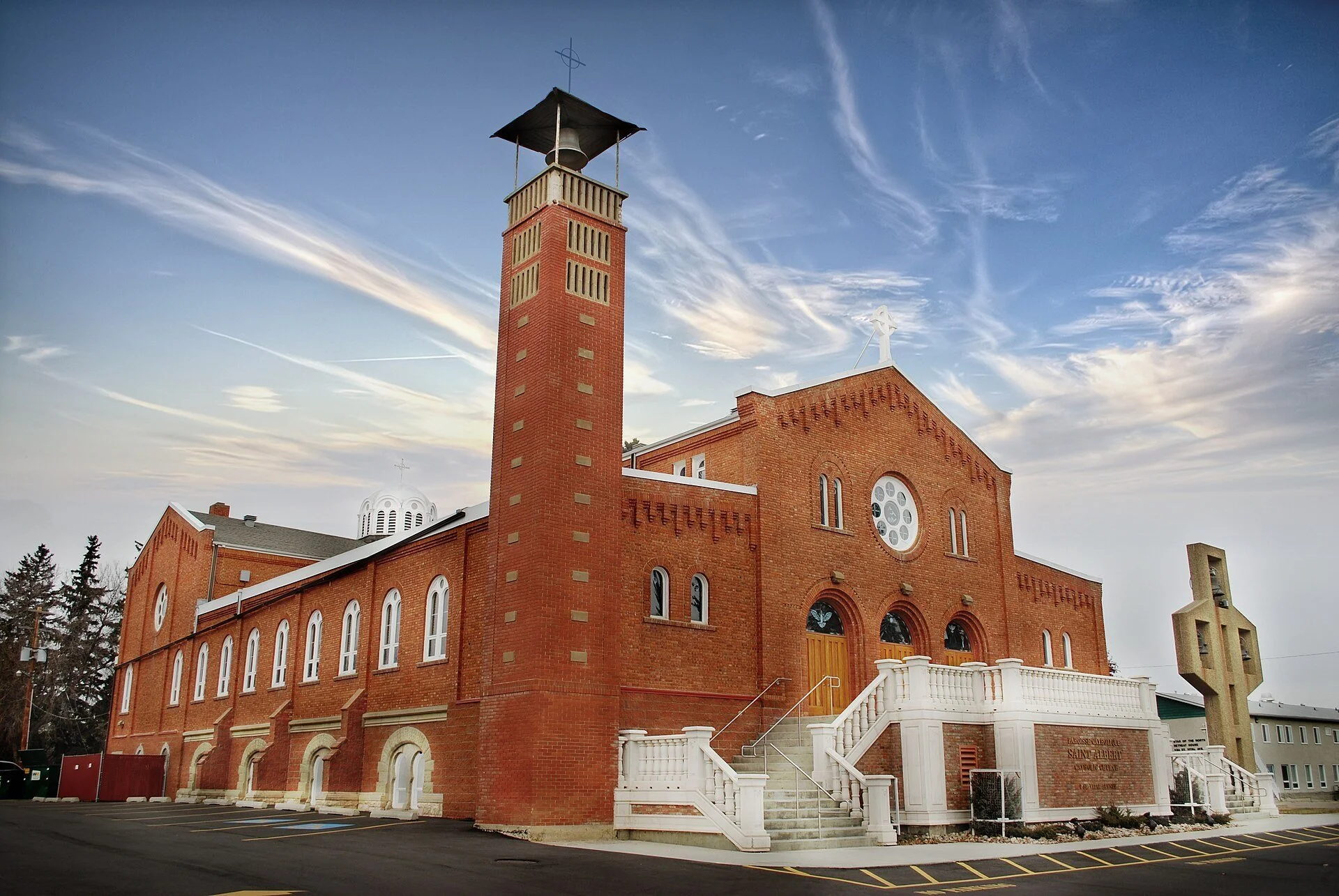 The red brick St. Albert Parish church and bell tower on Mission Hill in St. Albert, Alberta.