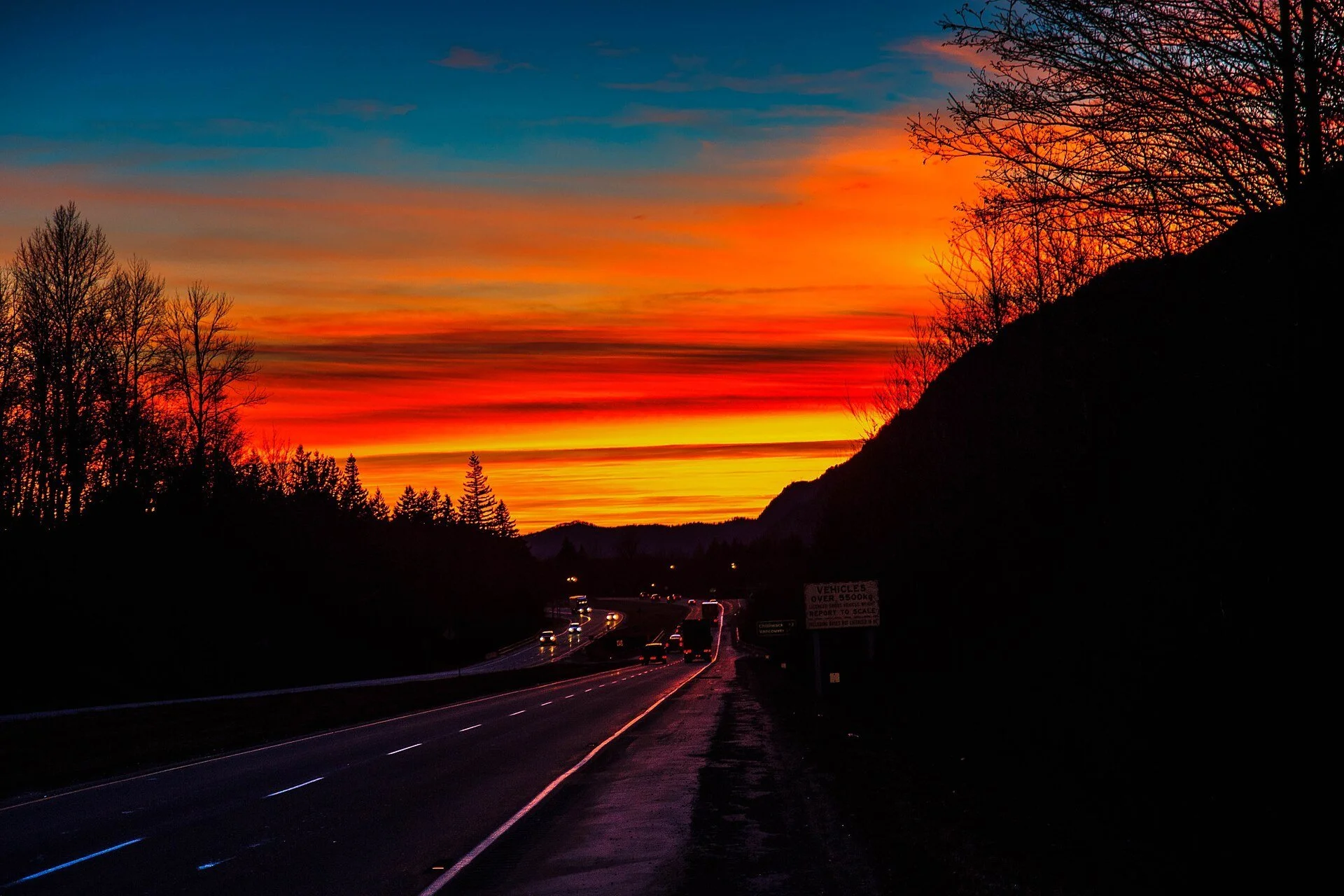 A bright orange sunset over Highway 1 near Chilliwack, BC.