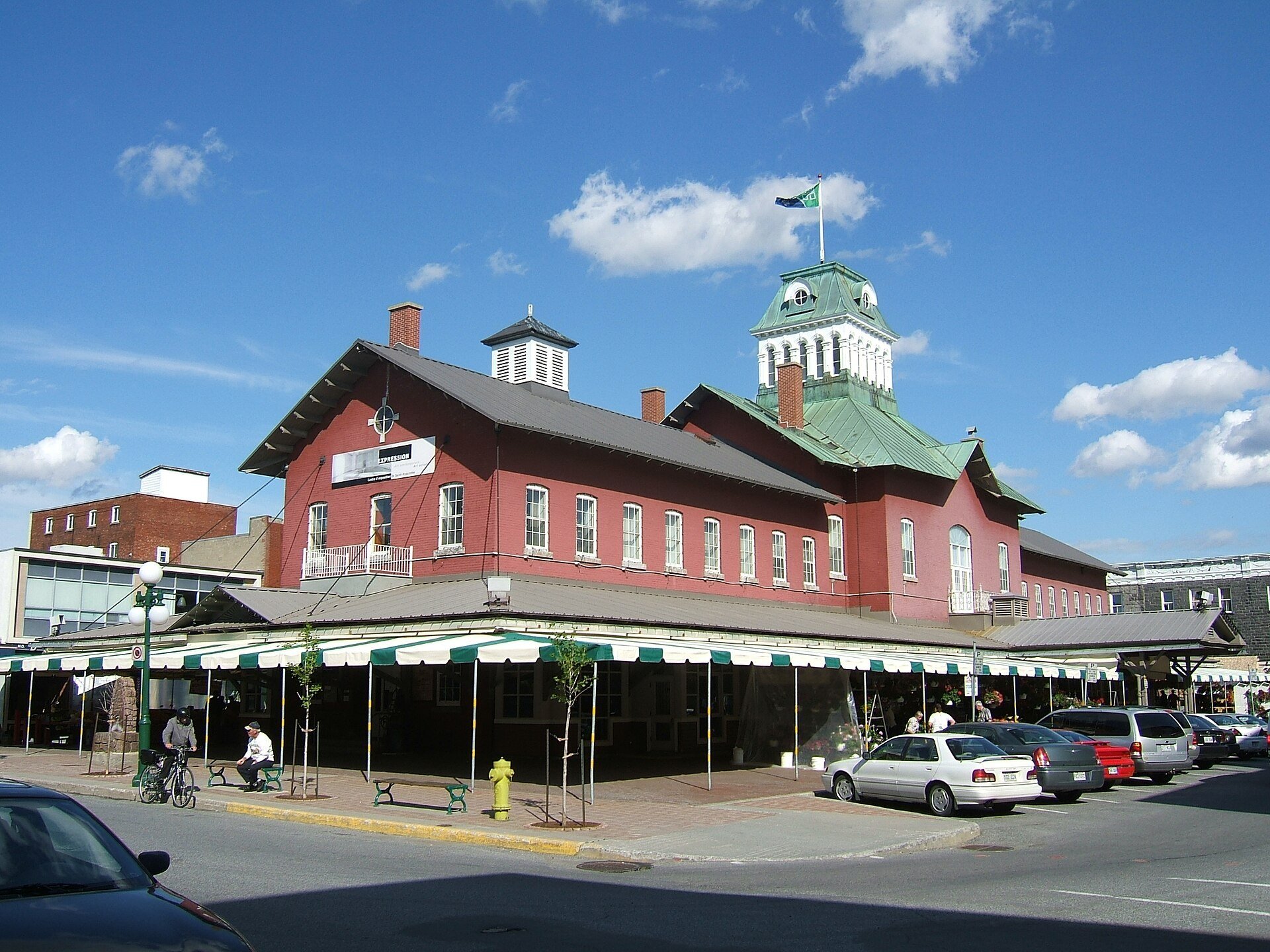 The red brick Marché-Centre public market building with its green cupola in downtown Saint-Hyacinthe, Quebec.