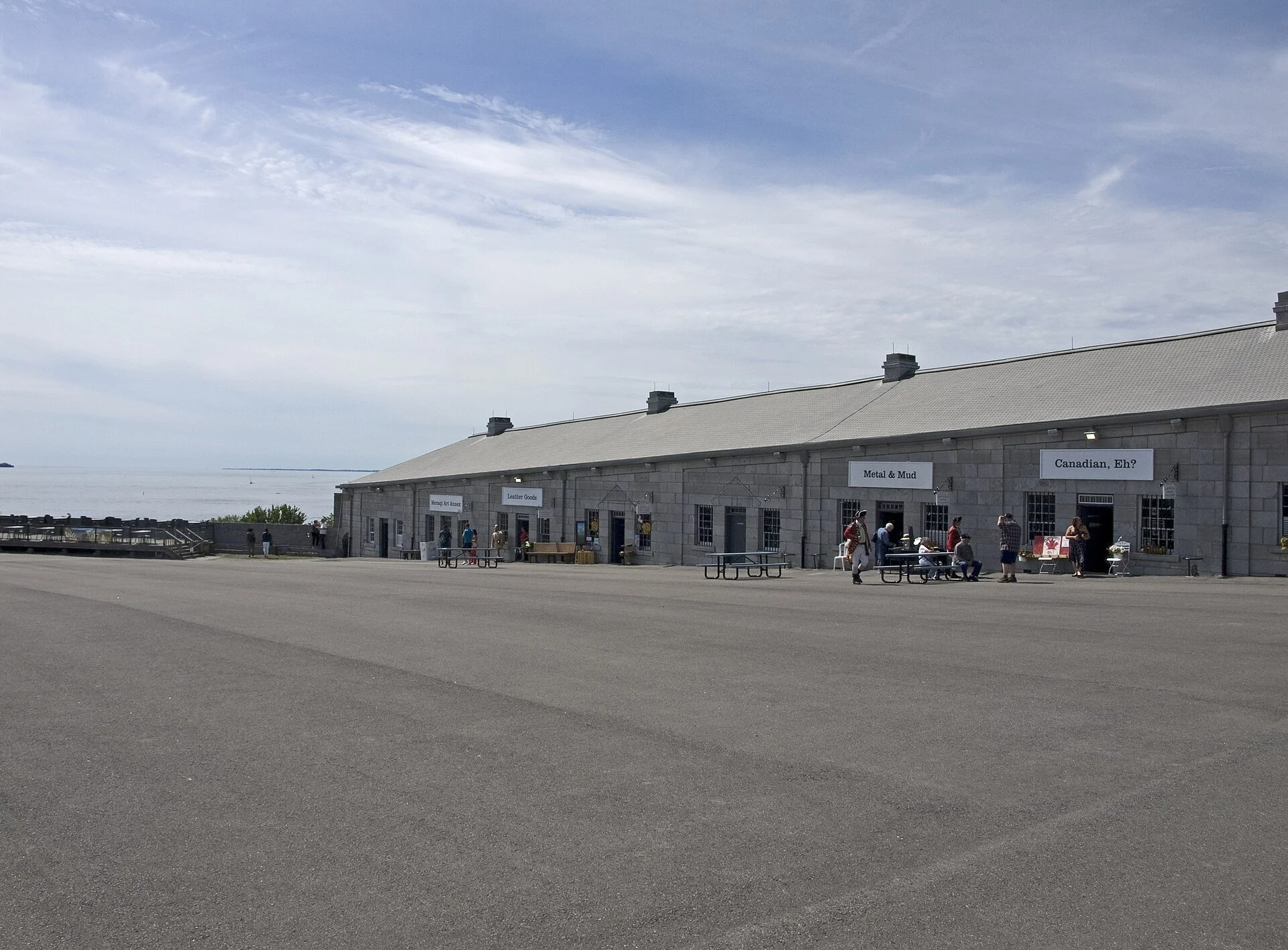 The long limestone buildings around the trade square at Fort Henry in Kingston, Ontario.