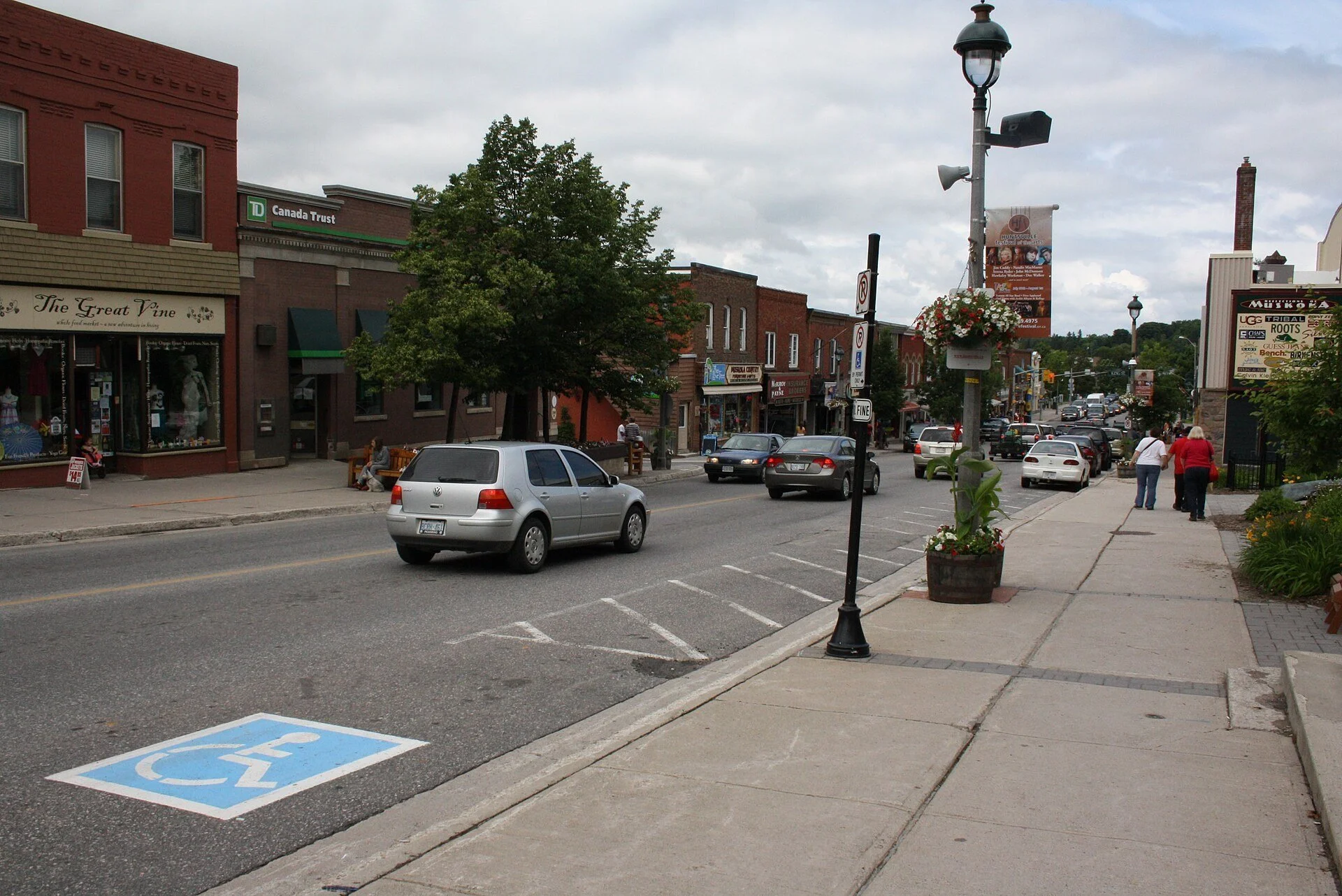 Shops and sidewalks along Main Street in downtown Huntsville, Ontario.