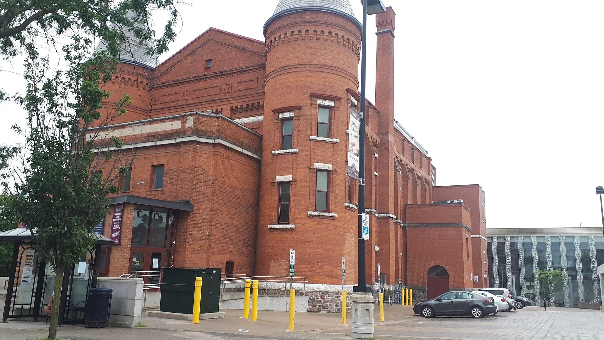 The red brick Orillia Opera House with its round corner tower on a summer day in downtown Orillia.