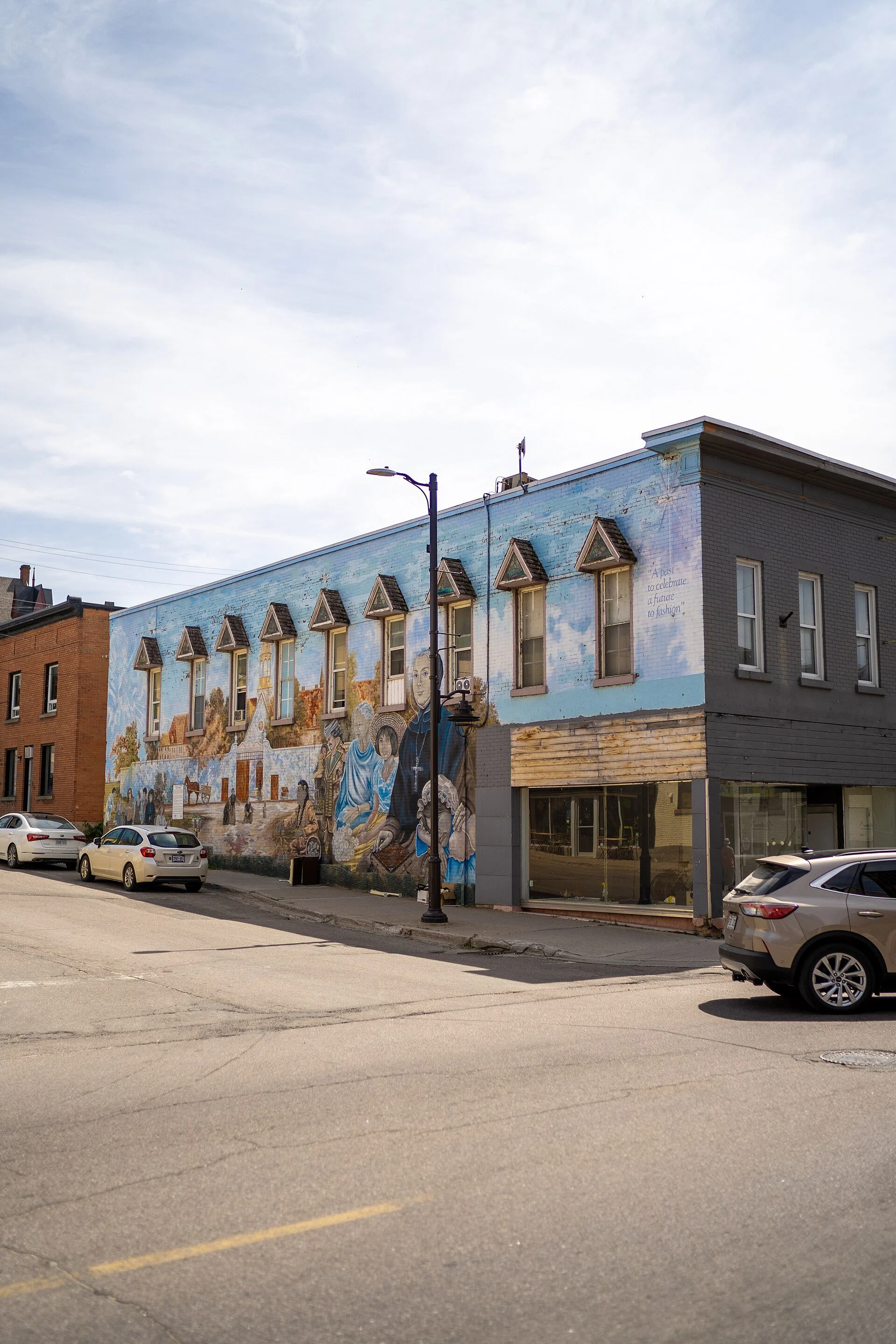 A large painted mural covering the side of a downtown building in Pembroke, Ontario.