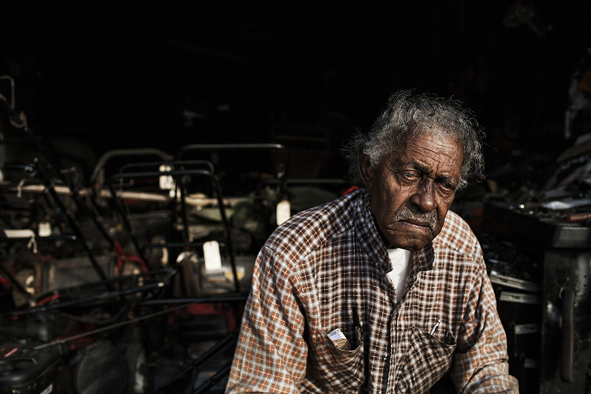 John Daye peers out from his garage where he repairs lawnmowers in Durham, N.C., on August 24, 2014. Daye has been repairing and selling lawnmowers for 21 years since his retirement as an engineer in the tobacco industry. Durham is home to the Ameri