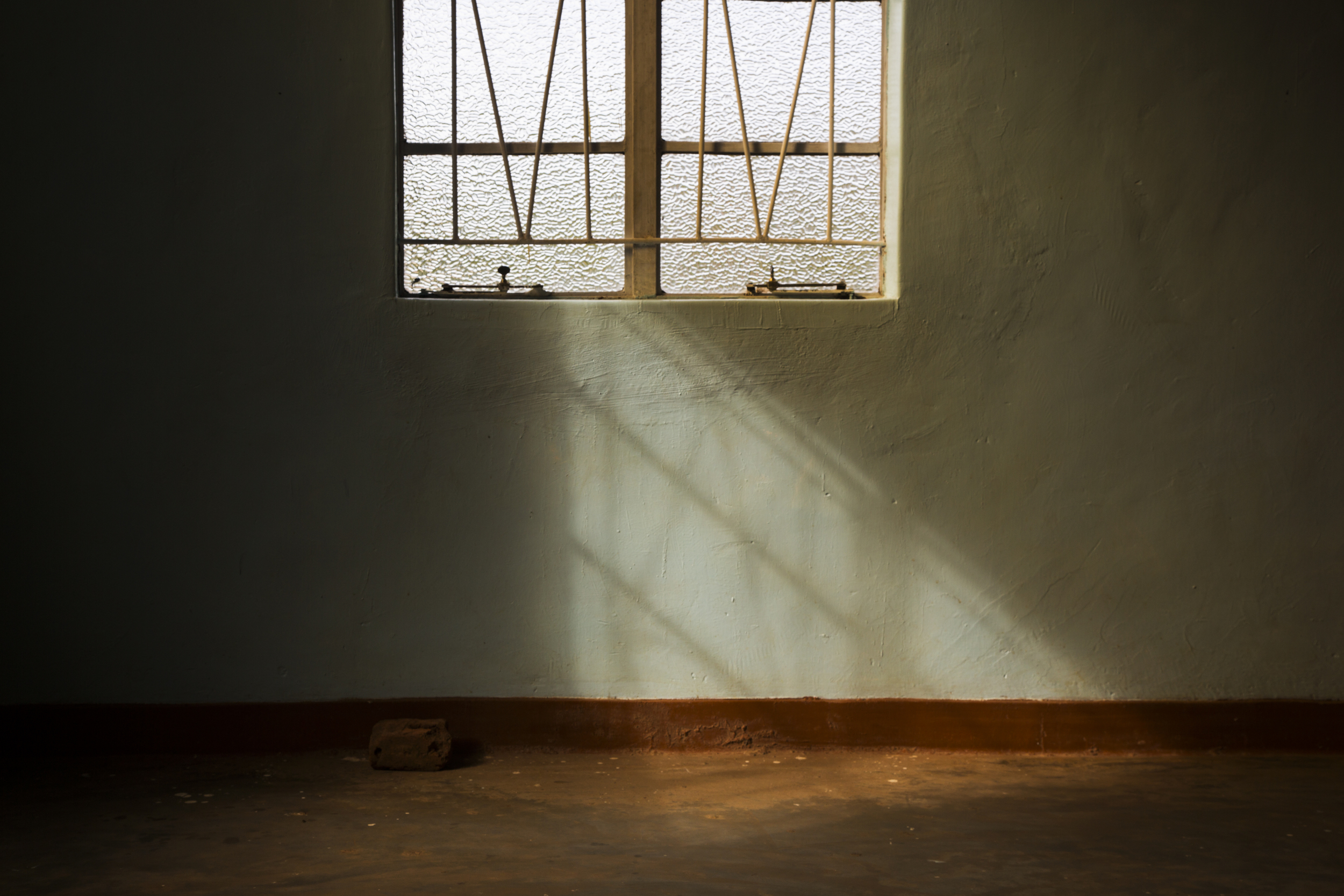  Morning light shines in through the window as members arrive at a Pentecostal church in Ntcheu District of Malawi, Africa on March 8, 2015. 