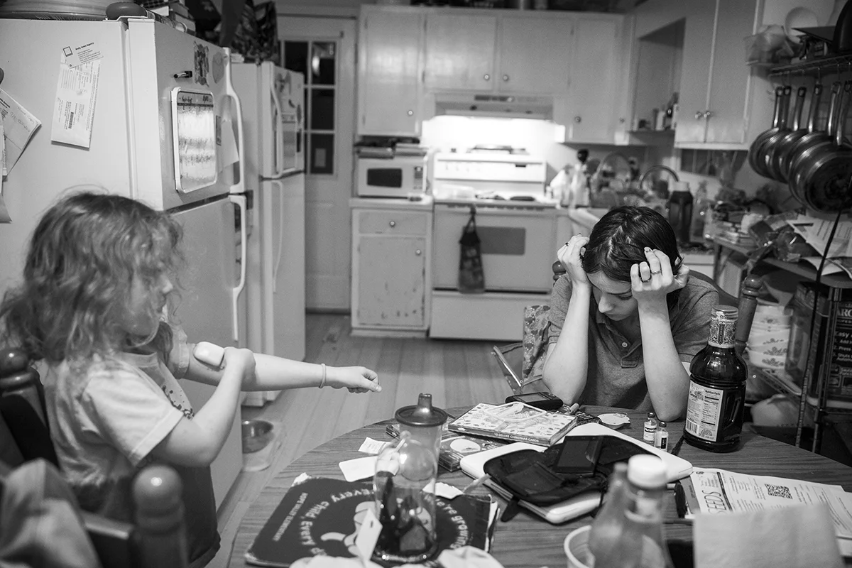  Arielle waits for the machine to read her daughters blood sugar levels after getting home from work.&nbsp; Katana was diagnosed with type one diabetes as an infant. 