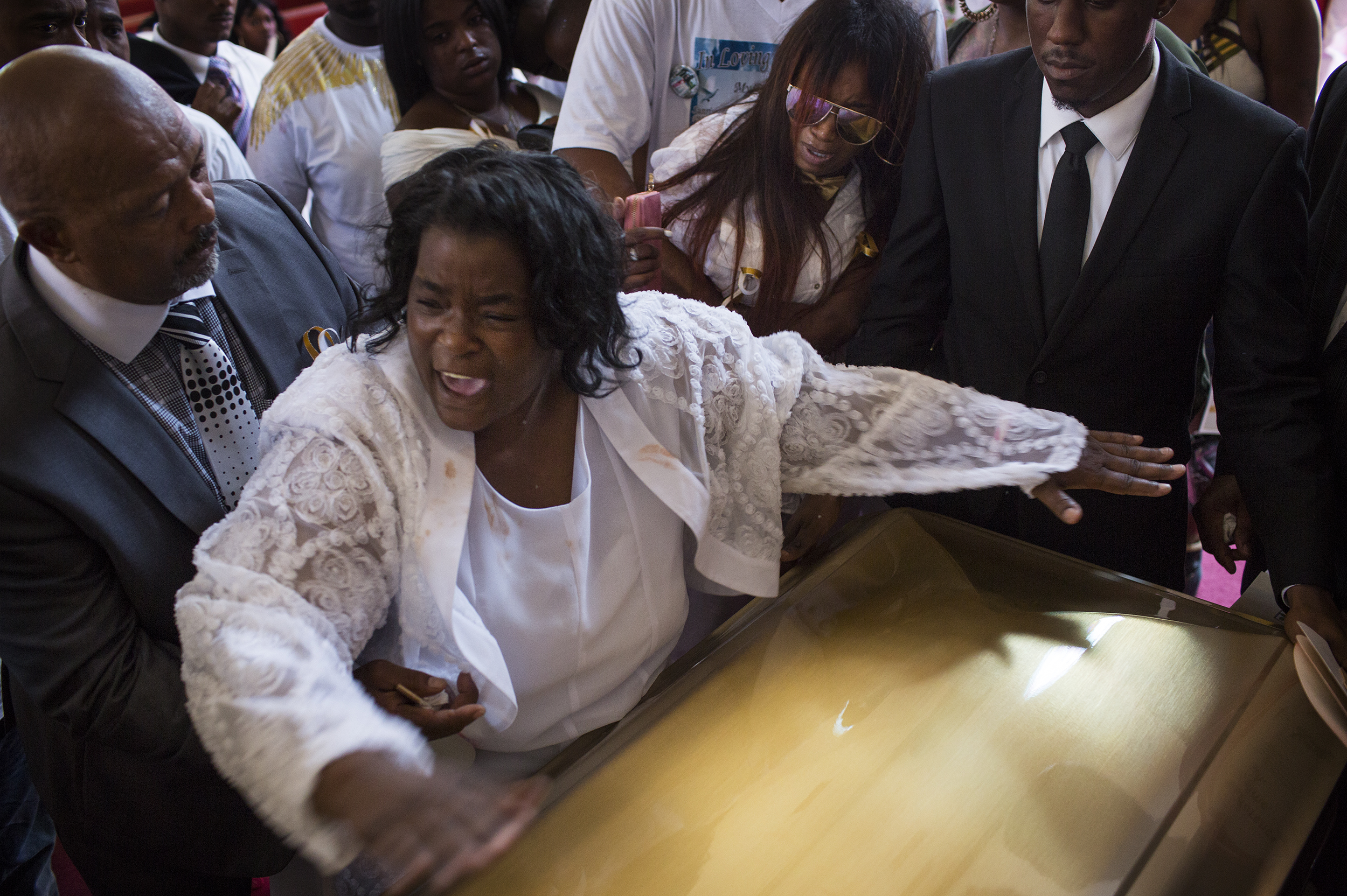  Barbara Pritchett-Hughes yells, "Its done. It's over," as she slams her son, DeAndre Hughes, casket shut at his funeral on Friday, July 29, 2016, after he was fatally shot a week earlier in Compton, CA. Barbara said her mind instantly flashed back t