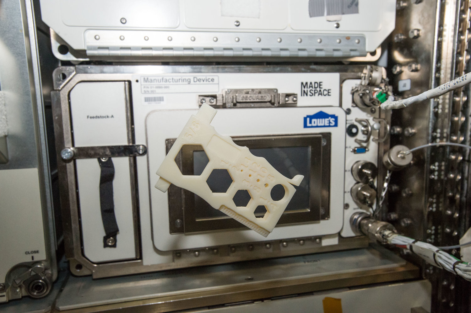  A 3D printed multi-tool, designed by students in the Future Engineers program, floats in front of Additive Manufacturing Facility on the International Space Station | Image credit: NASA 