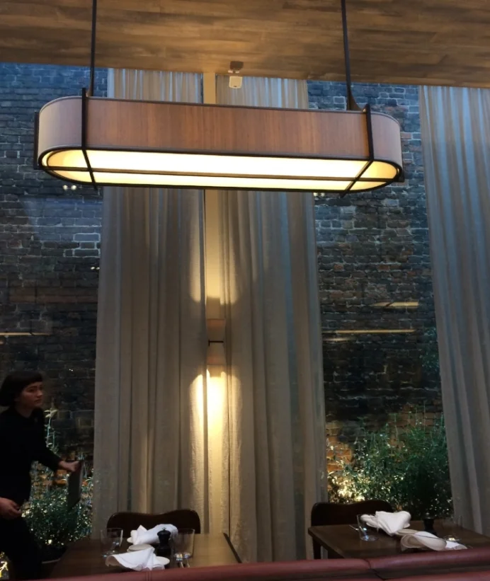 The main dining room gives on to a leafy courtyard and together with the linen curtains billowing softly in the breeze makes for a truly seductive place to sit.